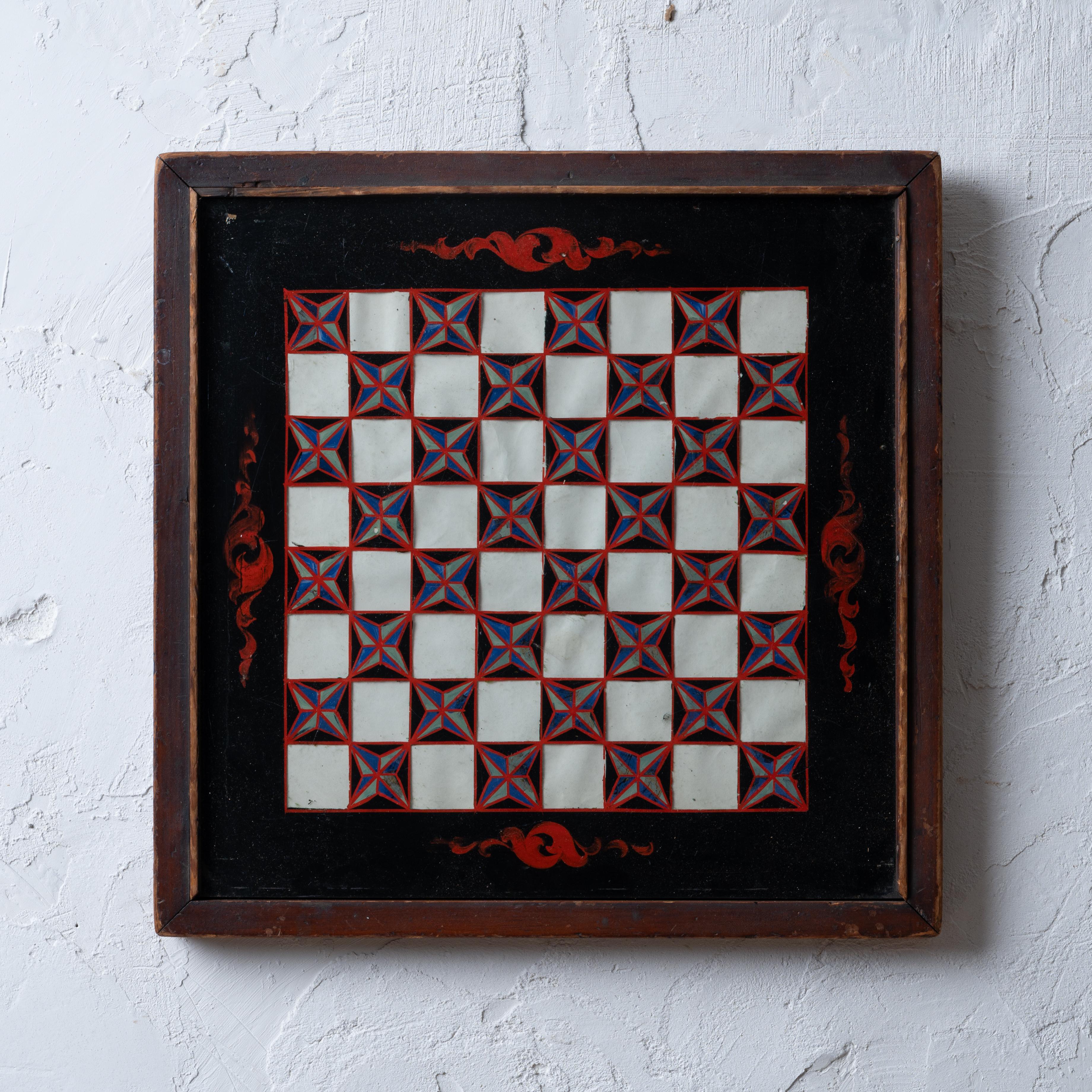 A verre eglomise chess board, circa 1890.

15 by 15 by 1 inches

