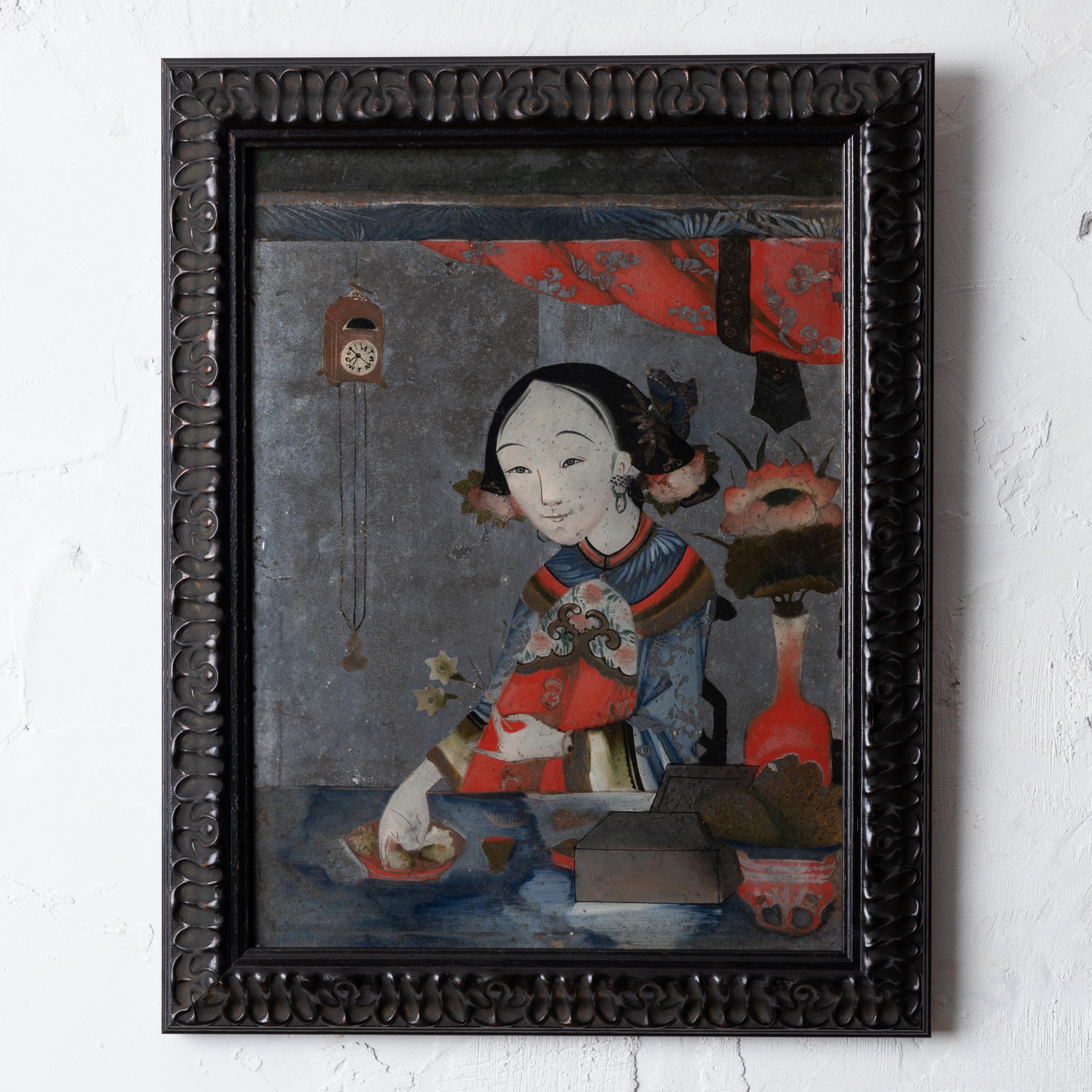 A verre eglomise Chinese export portrait painting, circa 1900. 

15 inches wide by 19 inches tall; 1 ½ inches deep

