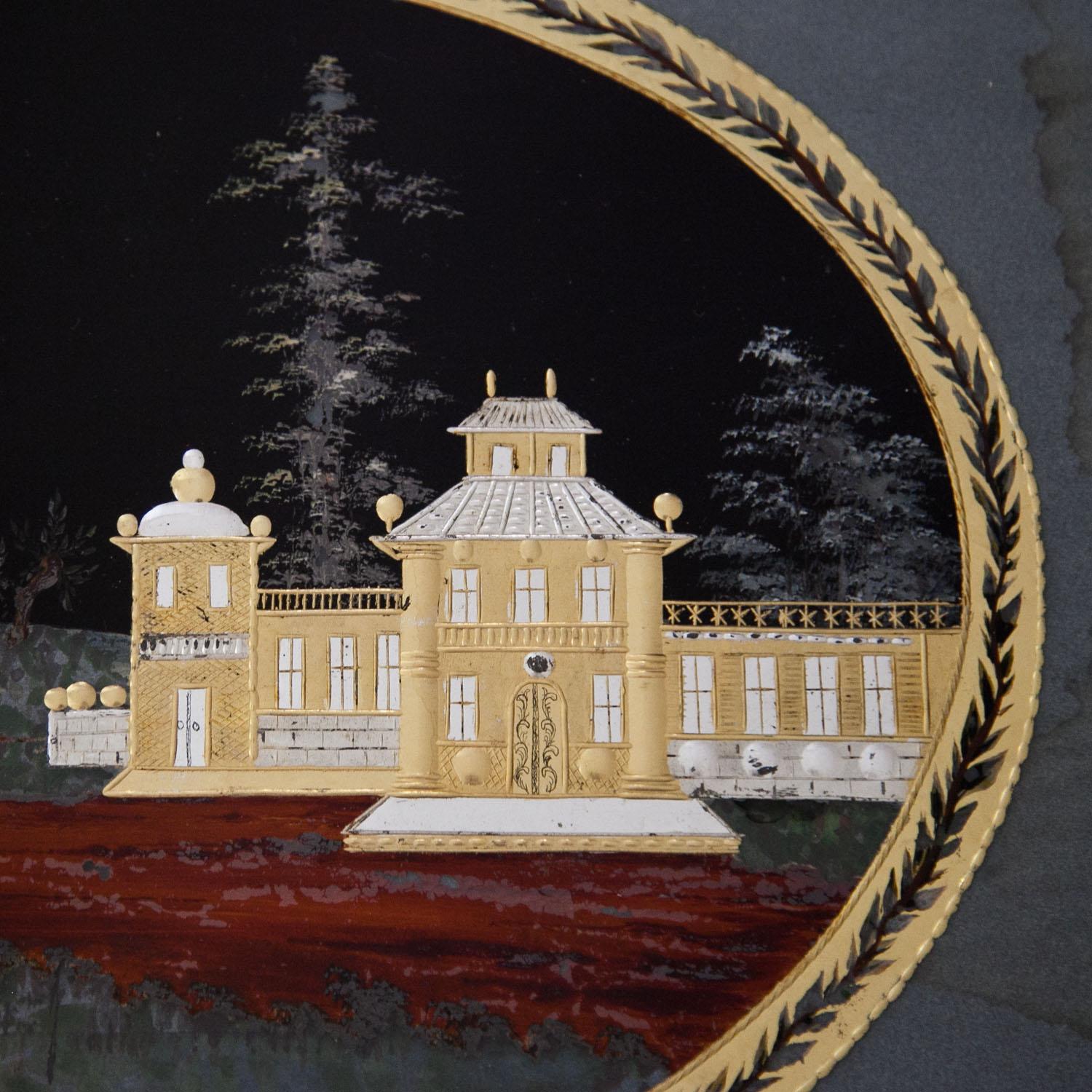 Oval painting of a landscape with architecture in verre églomisé. The painting is framed in a smooth wooden frame and shows some water stains.