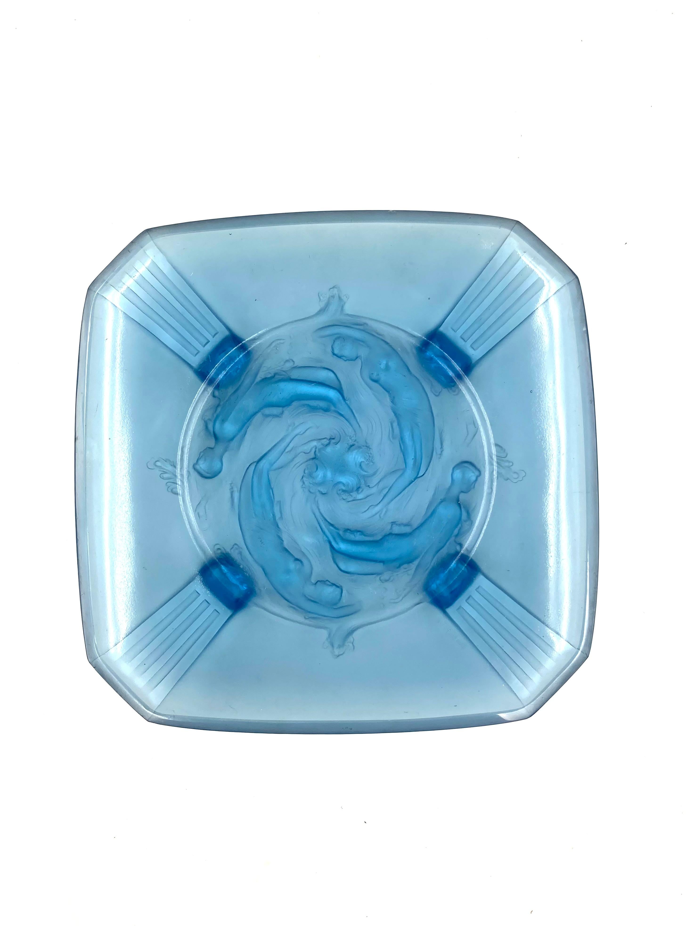 Important pressed moulded glass bowl / tray. Octagonal shape with Naiads decoration.

Verrieres Des Hanots, France, 1930s.

In Greek mythology, the naiads are a type of female spirit, or nymph, presiding over fountains, wells, springs, streams,