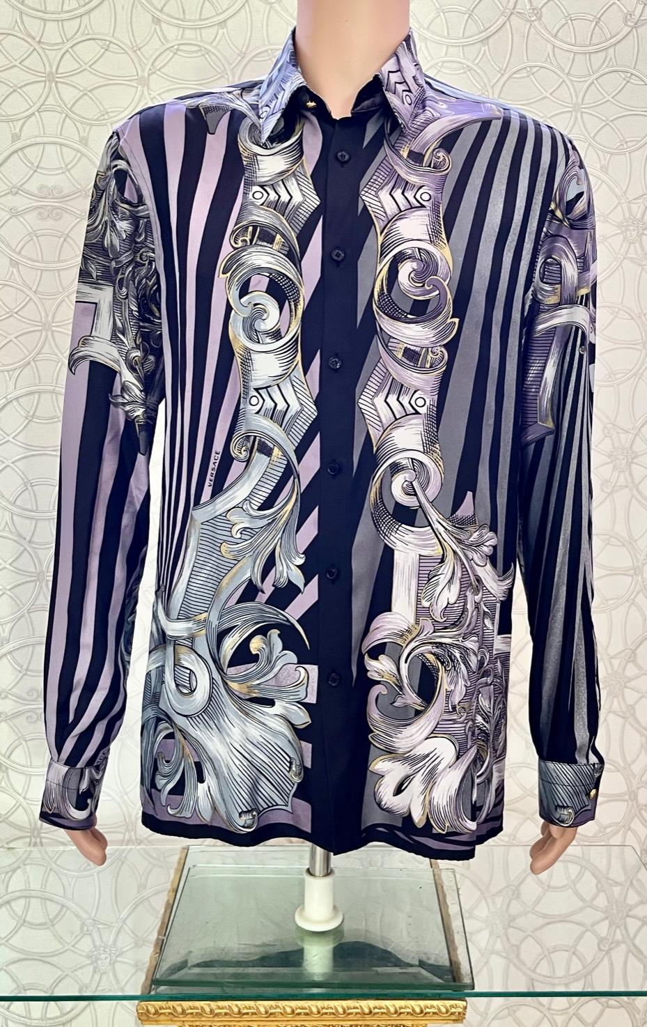 VERSACE SILK SHIRT

Demonstrate your taste for luxurious accessories and your love for Versace signed pieces with this rich silk shirt.
Relaxed fit
Signature buttons
Long sleeves 
Color: gray
Content: 100% silk


Made in Italy 

Size 40 - 50