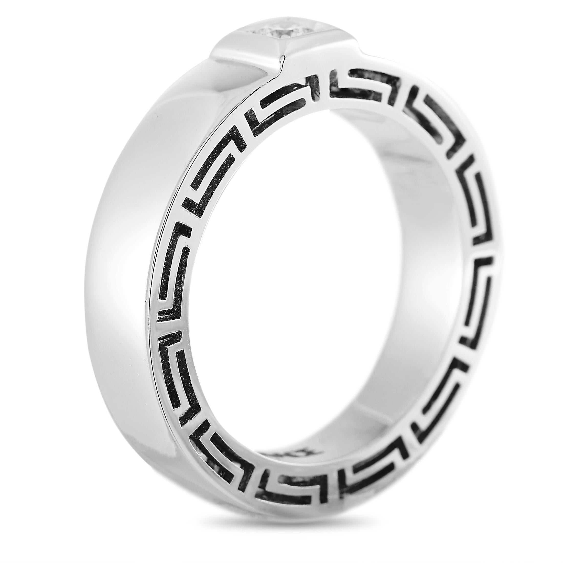 This Versace ring is made of 18K white gold and set with a 0.15 ct diamond stone. The ring weighs 9.6 grams and boasts band thickness of 4 mm and top height of 5 mm, while top dimensions measure 6 by 5 mm.
 
 Offered in brand new condition, this
