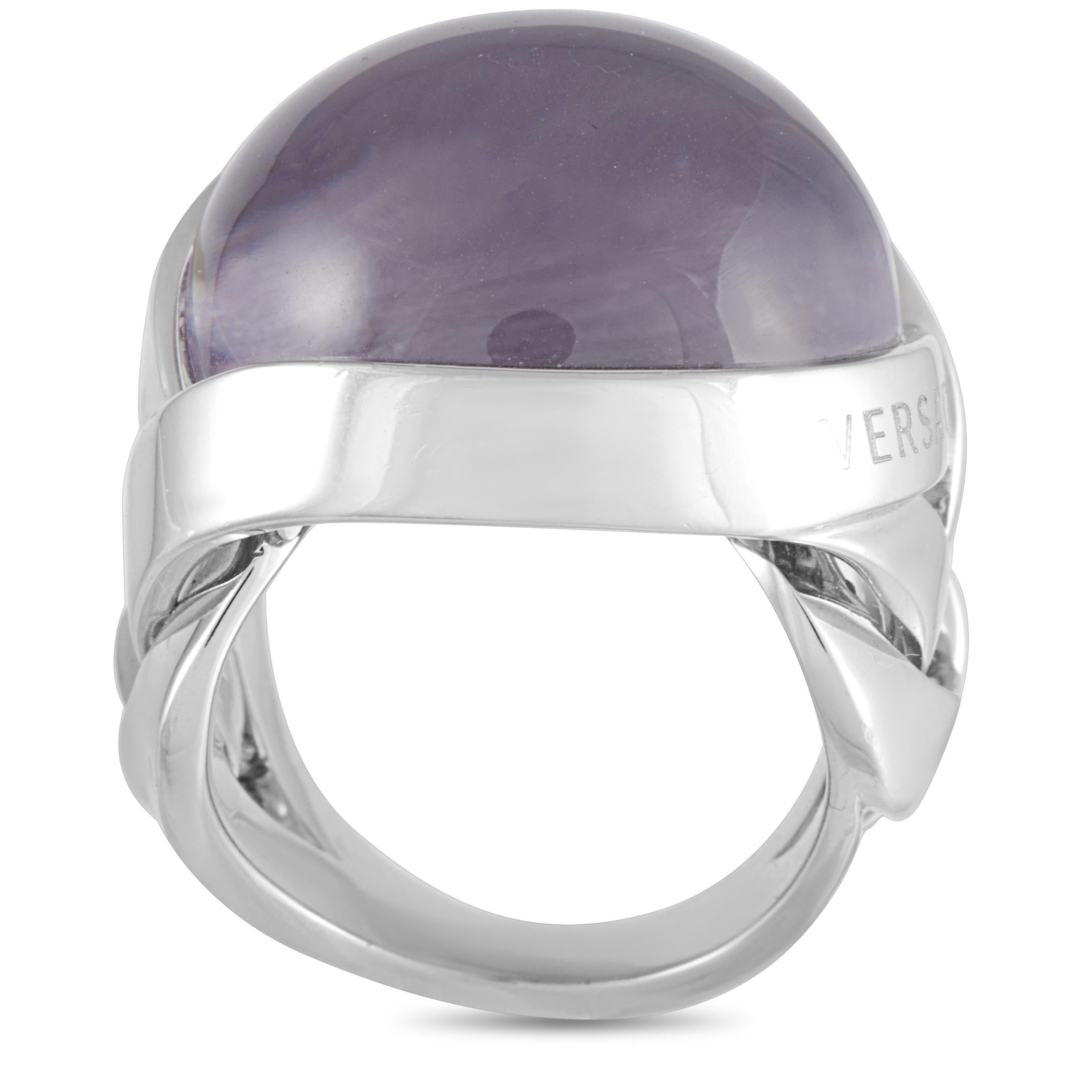 This Versace ring is crafted from 18K white gold and set with an amethyst. The ring weighs 28 grams, boasting band thickness of 17 mm and top height of 11 mm, while top dimensions measure 23 by 23 mm.
 
 Offered in estate condition, this item