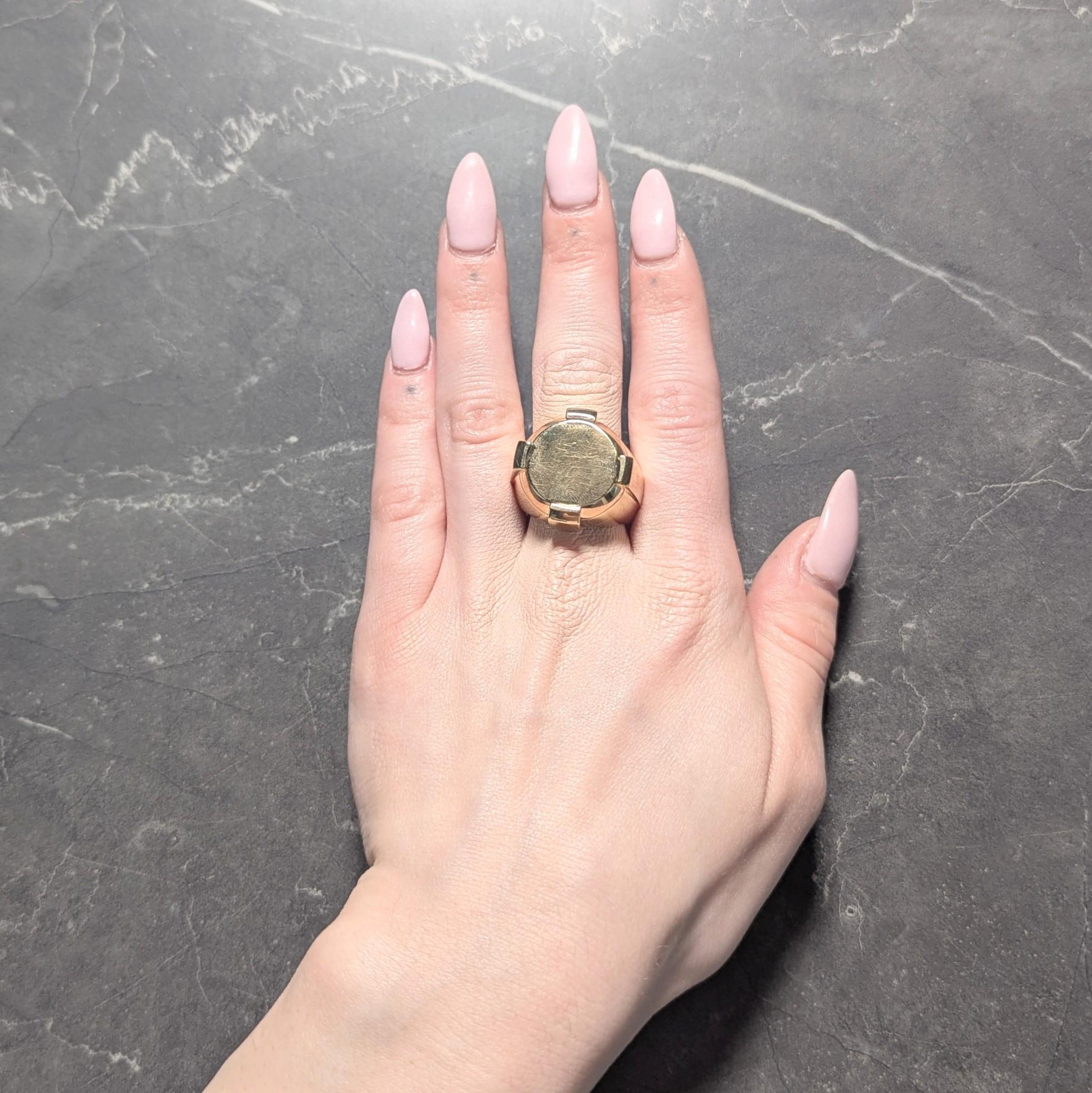 Designed as a domed form ring centering a round shaped signet face
Featuring raised rectangular column forms at cardinal points
Accented by grooved profile and high polish finish
Stamped with Italian assay mark for 18 karat gold
Fully signed on