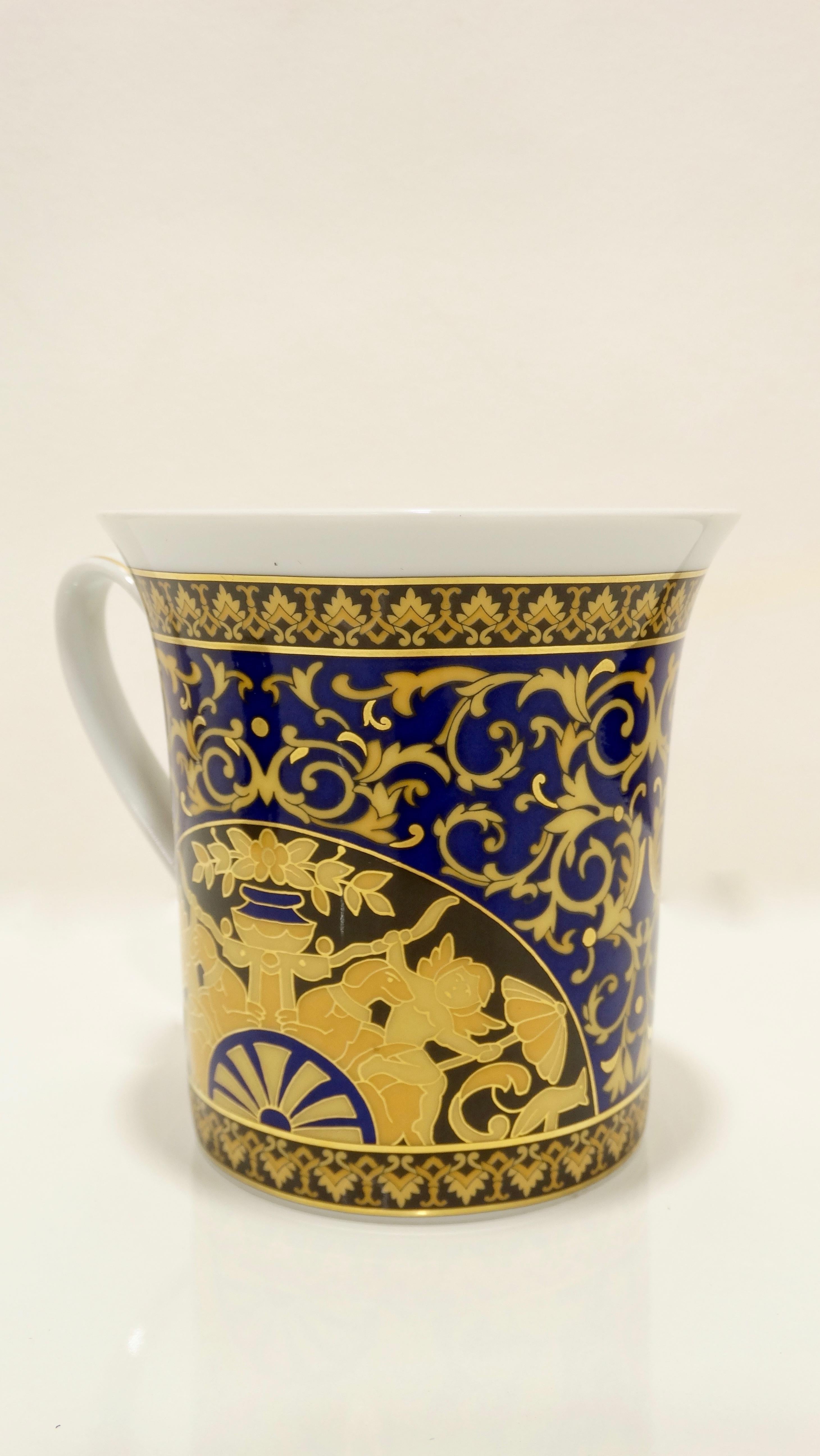 Sip in style with this Versace for Rosenthal mug! Circa recent 2000s, this porcelain mug comes from the Rosenthal Medusa Blue collection. Exterior of mug features a Roman mythology inspired motif, Versace's iconic baroque style pattern and
