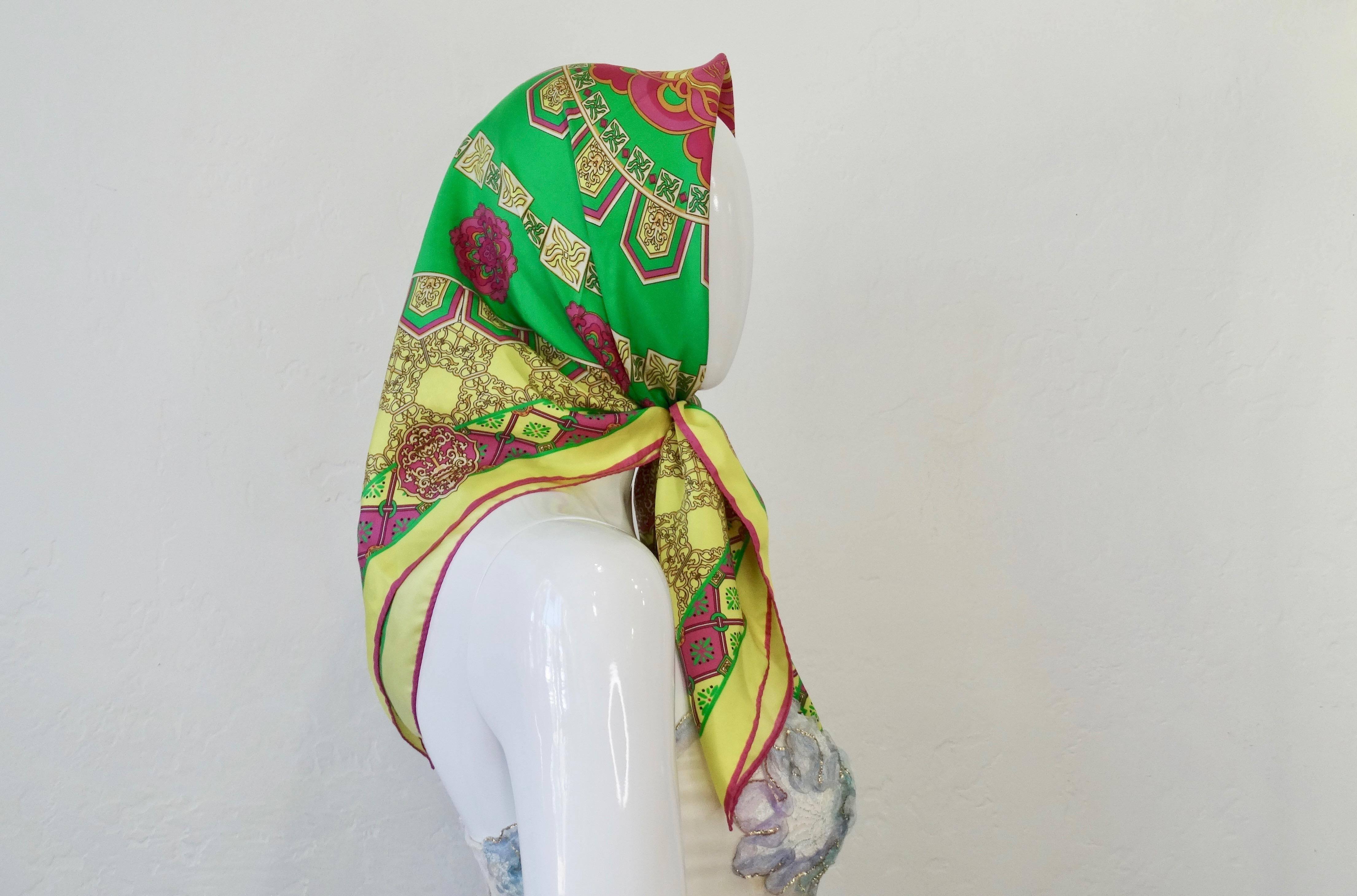 Add some color to your scarf collection with this amazing Versace scarf! Circa recent 2000s, this Silk scarf features a bright neon multi-colored motif with various intricate decorative designs surrounding the signature Versace Medusa. Signed