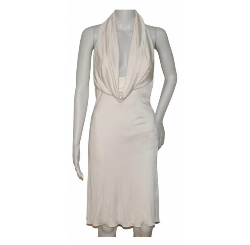  Versace  2001 white dress With good Medusa hardware in the back. 
Size tag is missing. Fits like Xs-S.  
Please note: due to nature of the fabric the measurements are approximate:
Length: 41 inches 
Armpit to armpit: 13 inches 
Waist: 13
