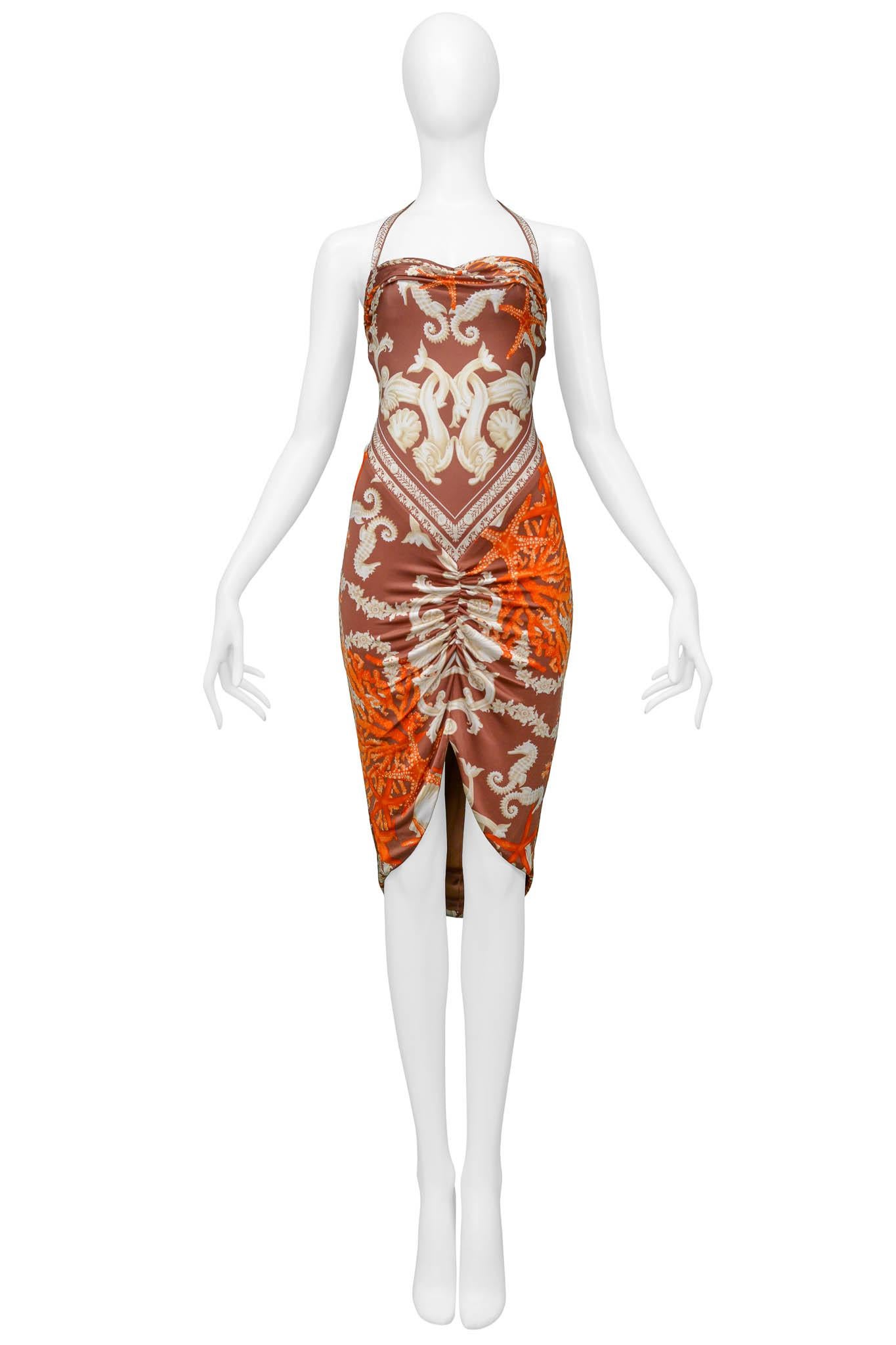 Resurrection Vintage is excited to offer a vintage Versace halter dress featuring a seahorse and coral print, ruching in the front and back skirt, Versace clasp closures, and an invisible back zipper. 

Versace 
Size 38
Rayon, Acetate, & Nylon