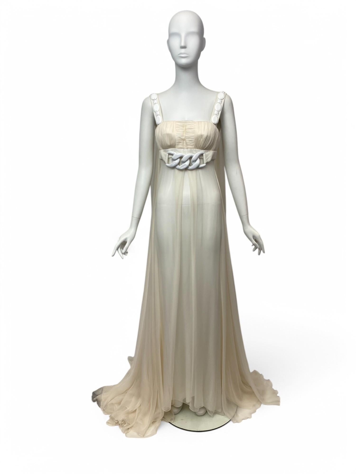A rare, unworn gem from Versace’s 2007 collection, this Silk Goddess Evening Gown is the epitome of timeless elegance and modern glamour. Crafted in soft ivory silk, the gown channels Grecian inspiration with its fluid draping, gathered bodice, and
