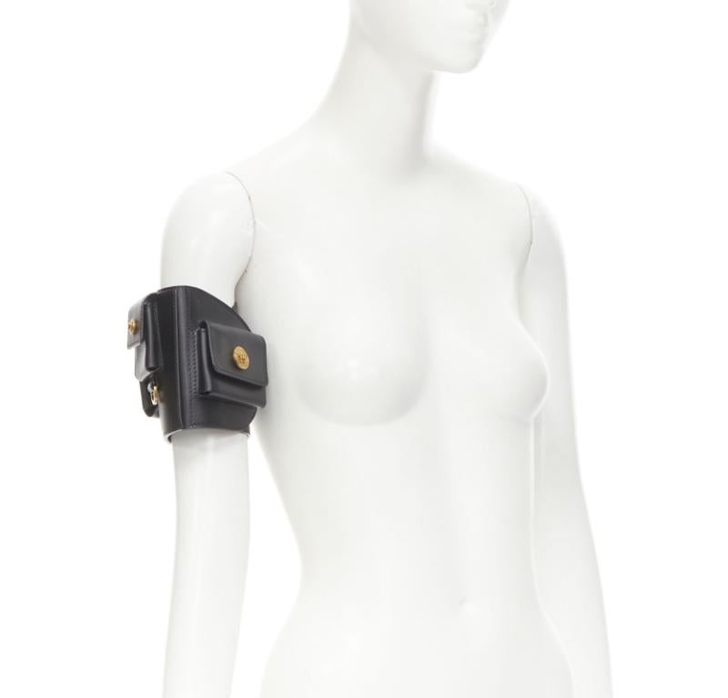 VERSACE 2019 Runway black gold Medusa multipocket harness arm bag Rare
Reference: TGAS/C00892
Brand: Versace
Designer: Donatella Versace
Model: DP8H176 D6VIT K41OT
Collection: Pre Fall 2019 - Runway
Material: Leather
Color: Black, Gold
Pattern: