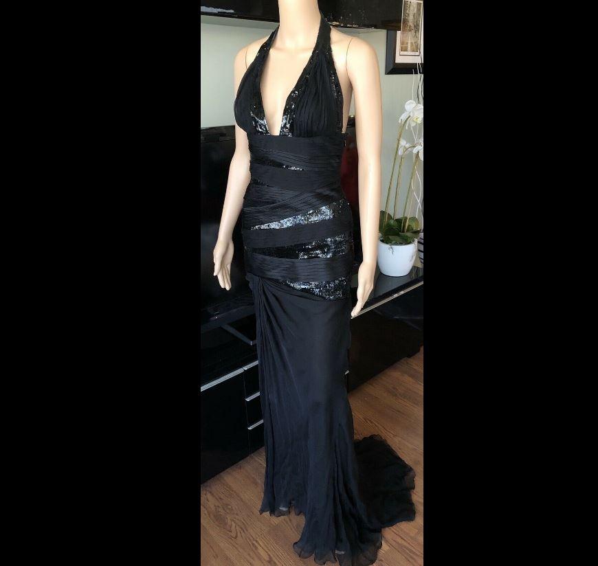 VERSACE RUNWAY Sexy Embellished Plunging Neckline Dress Gown

Black Versace dress with sequin trim throughout, halter top and concealed zip closure at side. Includes tags.

RETAIL $20,905 + TAX

About Versace: Founded in 1978 by the late Gianni