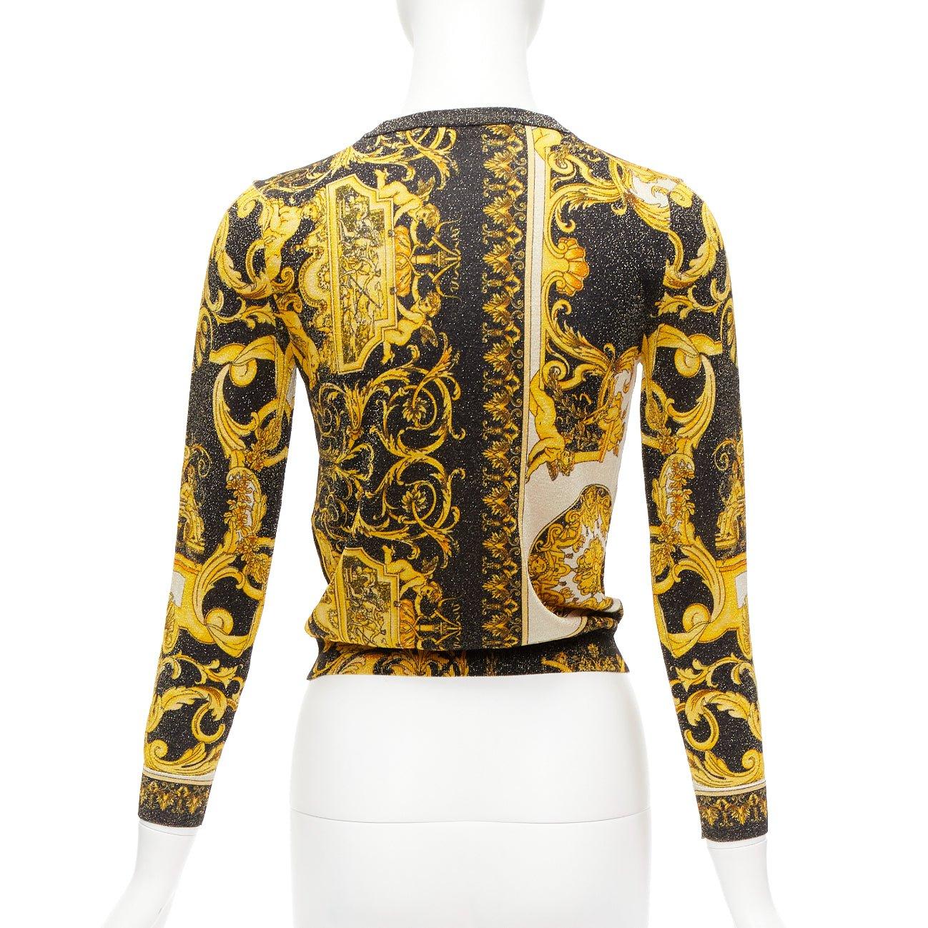 VERSACE  Barocco Tribute gold metallic lurex knit Medusa button cardigan IT38 XS
Reference: AAWC/A00628
Brand: Versace
Designer: Donatella Versace
Material: Viscose, Polyester
Color: Gold, Black
Pattern: Other
Closure: Button
Extra Details: Metallic