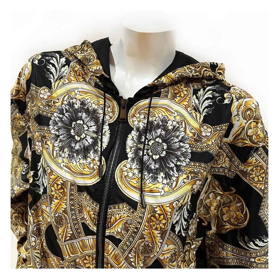 Baroque Hooded Windbreaker Jacket by Versace
2017 
Made in Italy
Black/gold
Baroque print throughout jacket
Front zip closure
Dual side pockets
Hood detail with drawstring closure
Bottom of jacket has stretchy adjustable draw string detail
Long