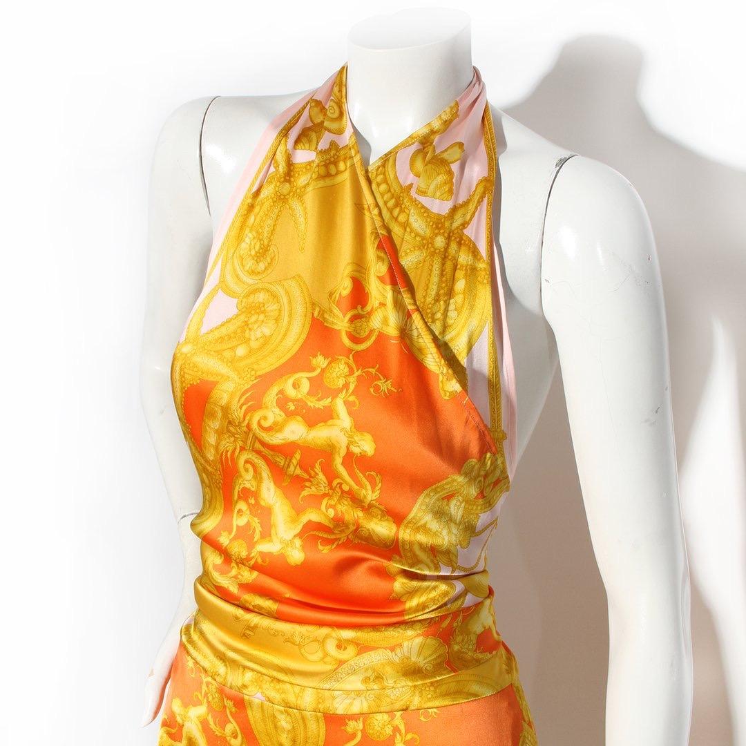 Versace by Donatella Versace Dress
Spring / Summer 2005 Ready-to-Wear Collection 
As seen on the runway on Daria Werbowy 
Made in Italy 
Orange and Pink
Yellow baroque print 
Halter neck 
Halter neck Medusa closure 
Back of dress has invisible