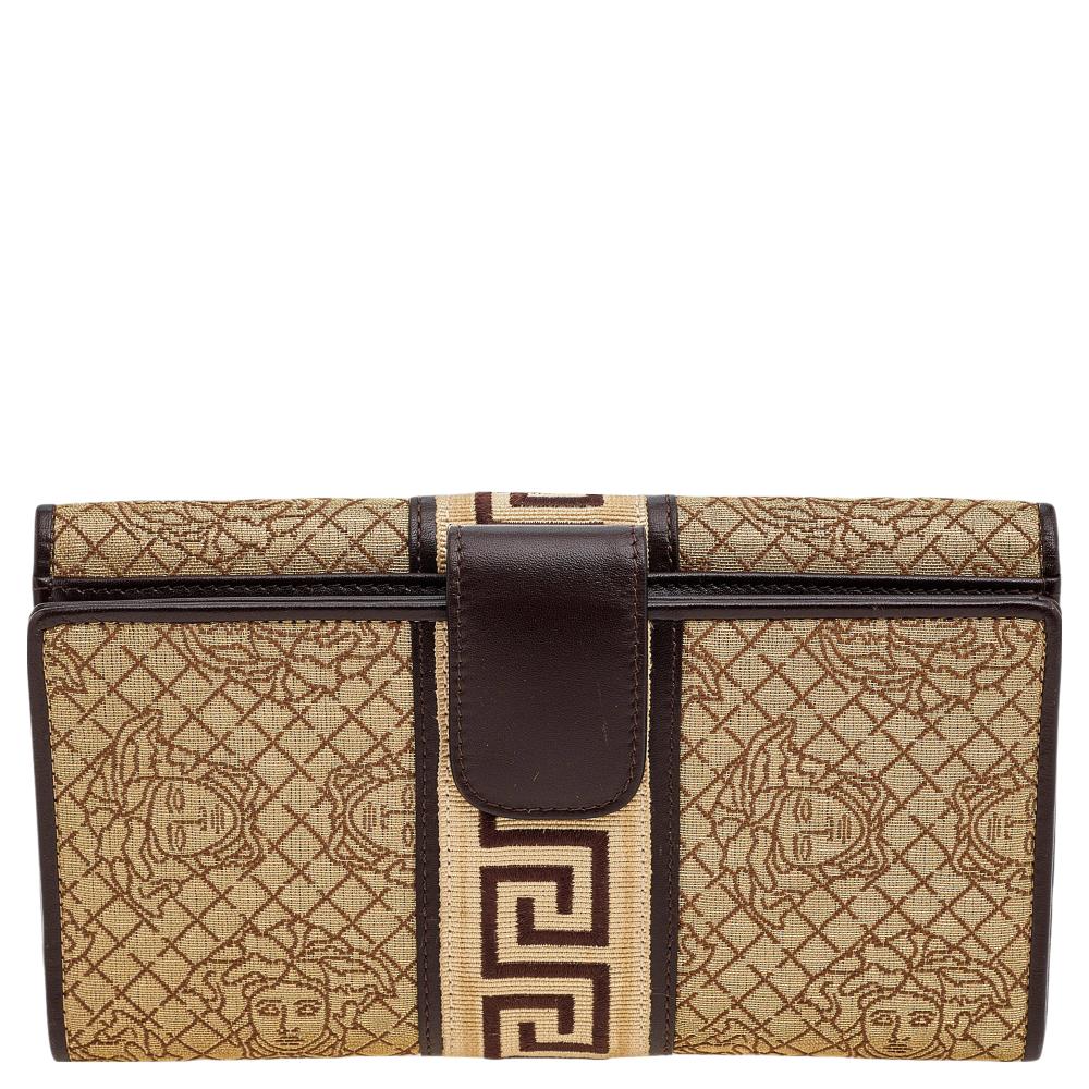 Keep your belongings stylishly and safely in this continental wallet from the House of Versace. It is made from beige-brown Medusa canvas and leather, with a gold-toned logo detail adorning the front. It provides a satin-leather, which can carry