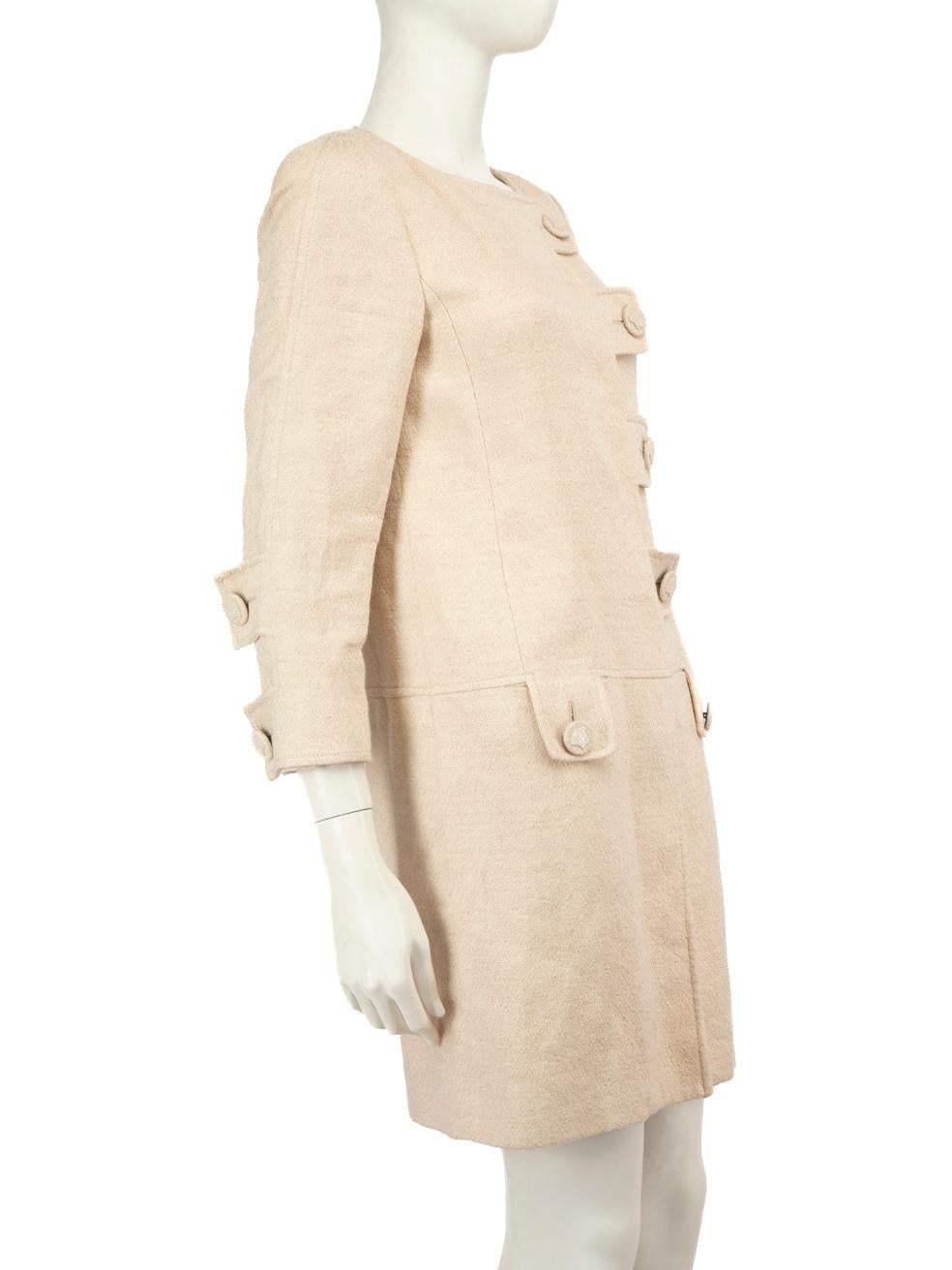 CONDITION is Good. Minor wear to coat is evident. The chained brand label is partly detached. There is discolouration on the lining around the underarm area and a small pull to the weave on the front right panel
 of this used Versace designer resale