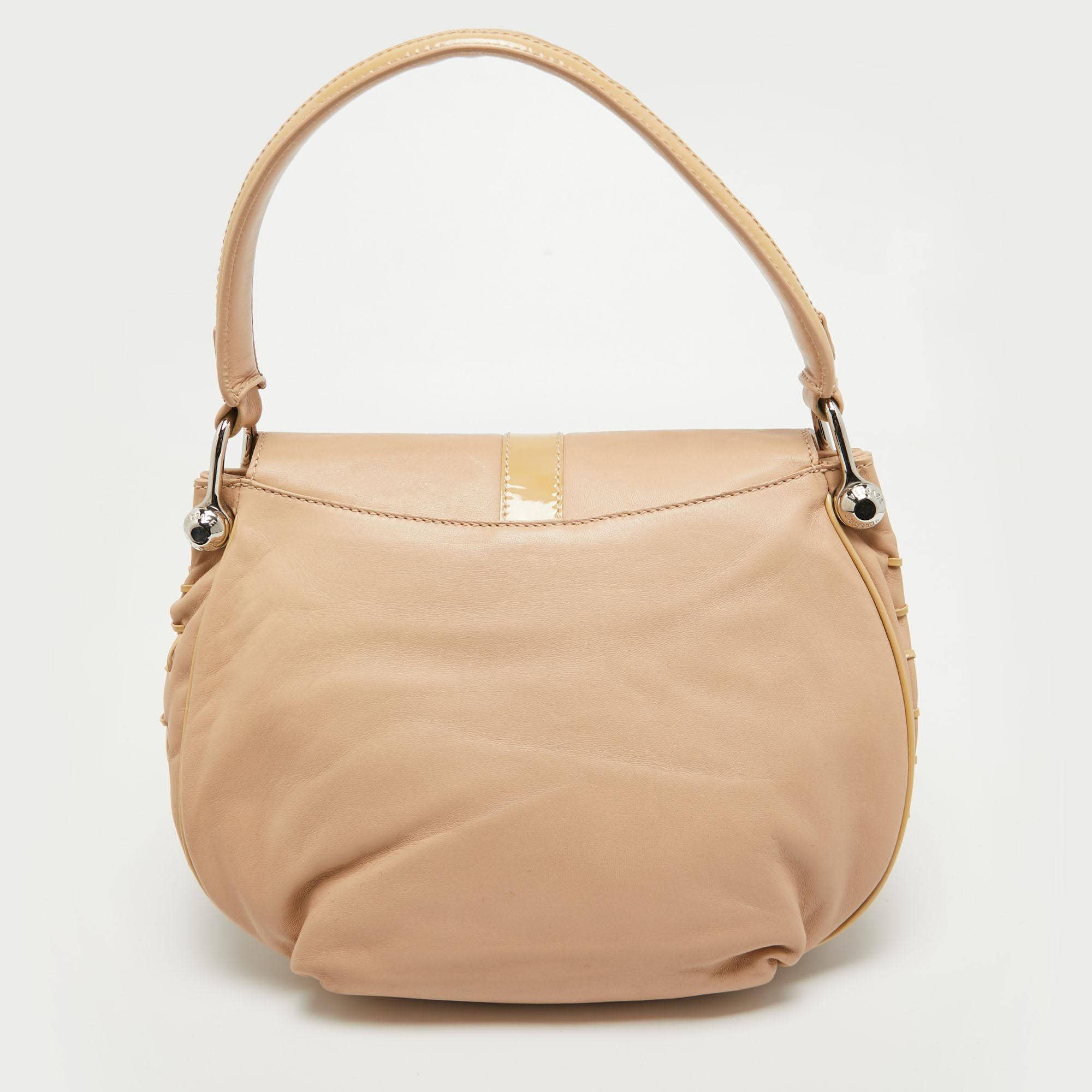 Stylish handbags never fail to make a fashionable impression. Make this designer hobo yours by pairing it with your sophisticated workwear as well as playful casual looks.

Includes: Info Booklet, Brand Tag