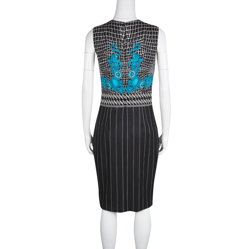 With a sleek cut and smart silhouette, this Versace sleeveless dress is sure to stand out and create a unique look. Designed on a black background fabric, this dress features blue print along the bodice with the iconic Medusa print adorning the