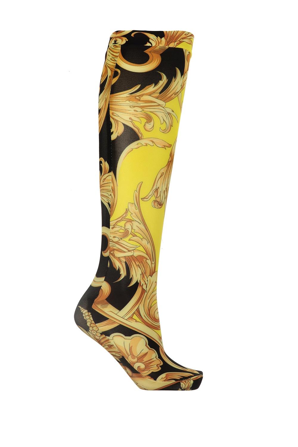 Versace Black and Gold Barocco Femme Print Ladies Socks

These Versace socks are decorated with the opulent Barocco Femme print, which includes black, yellow, and brown. Pair it with Versace heels to make a statement. Brand new. Made in