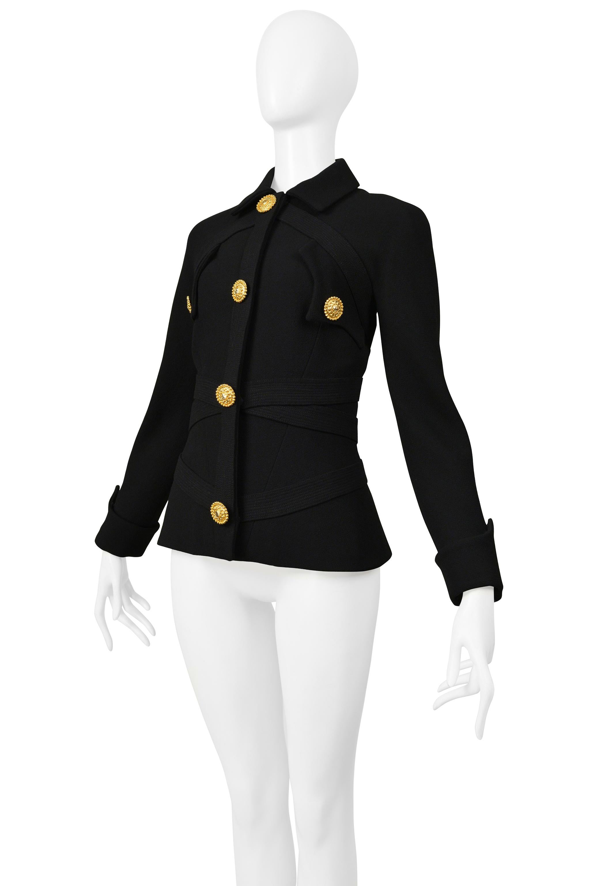 Resurrection Vintage is excited to offer a vintage Gianni Versace black wool jacket featuring horizontal bondage straps with heavy stitching, folding cuffs, pointed chest pockets, and gold Medusa buttons.

* Versace
* Size: 38
* Fabric: 100% Wool
*