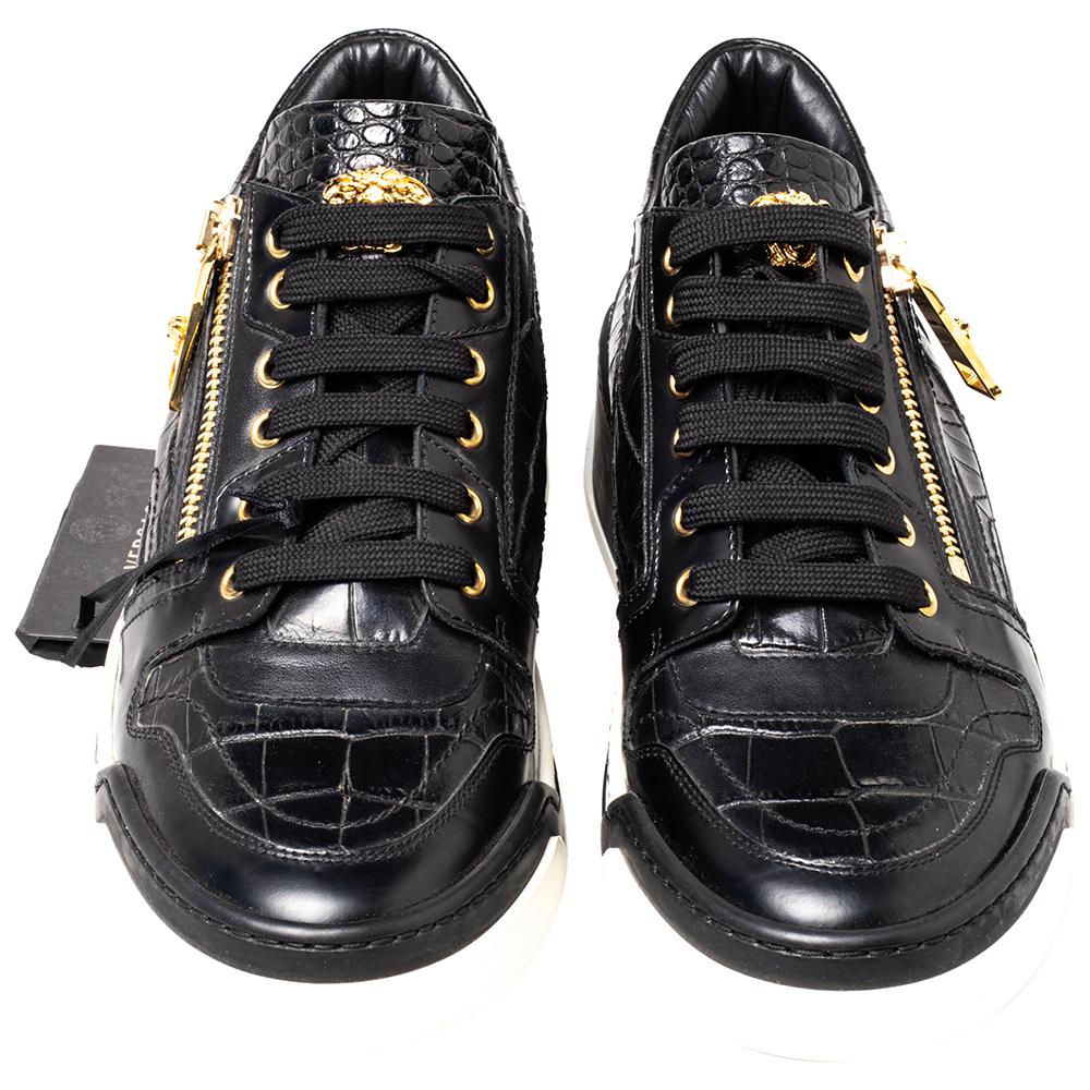 These sneakers are the epitome of versatility, meant to lend a luxe twist to your outfit. Looking fashionable in your casuals is as easy as slipping in these gorgeous black sneakers crafted from leather with croc-embossed panels. Designed by