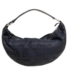 Versace - Hobo en tissu brodé noir clouté