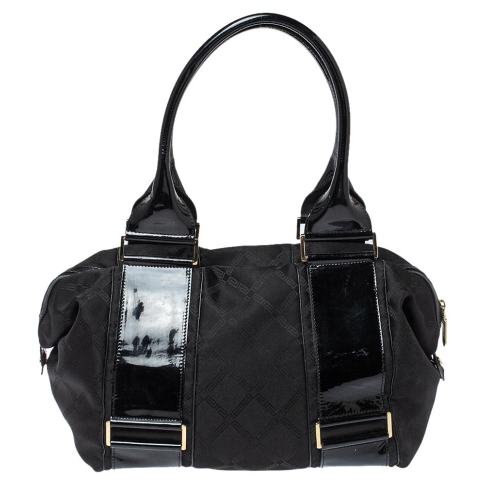 Exhibiting an up-to-date design, this tote from the house of Versace is an instant hit among fashionistas. The inside of this chic bag is beautifully stitched with satin for perfection. This fabric and patent leather bag are found in the hands of