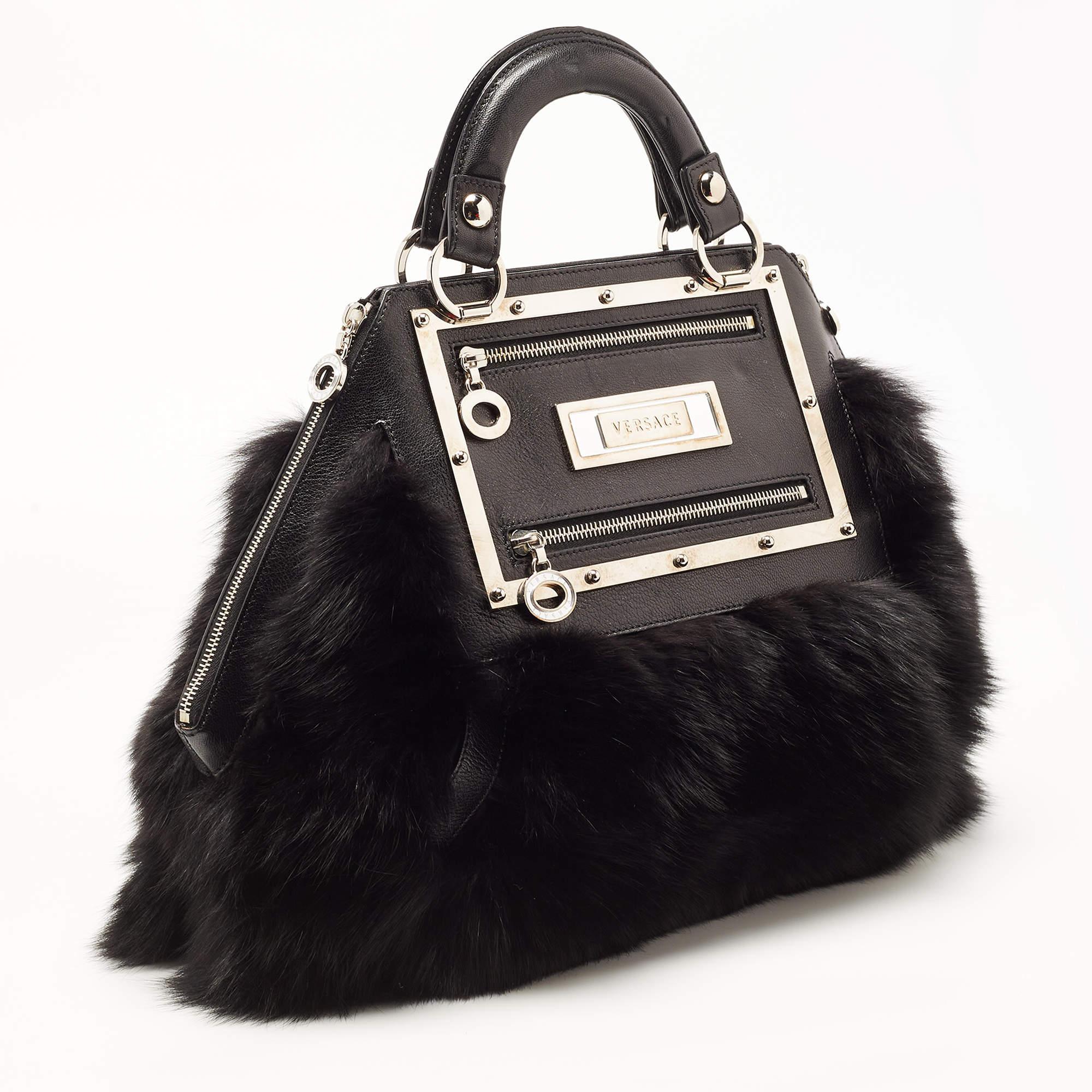 This Versace bag promises to take you through the day with ease, whether you're at work or out and about in the city. From its design to its structure, the fox fur and leather bag promises charm and durability.

