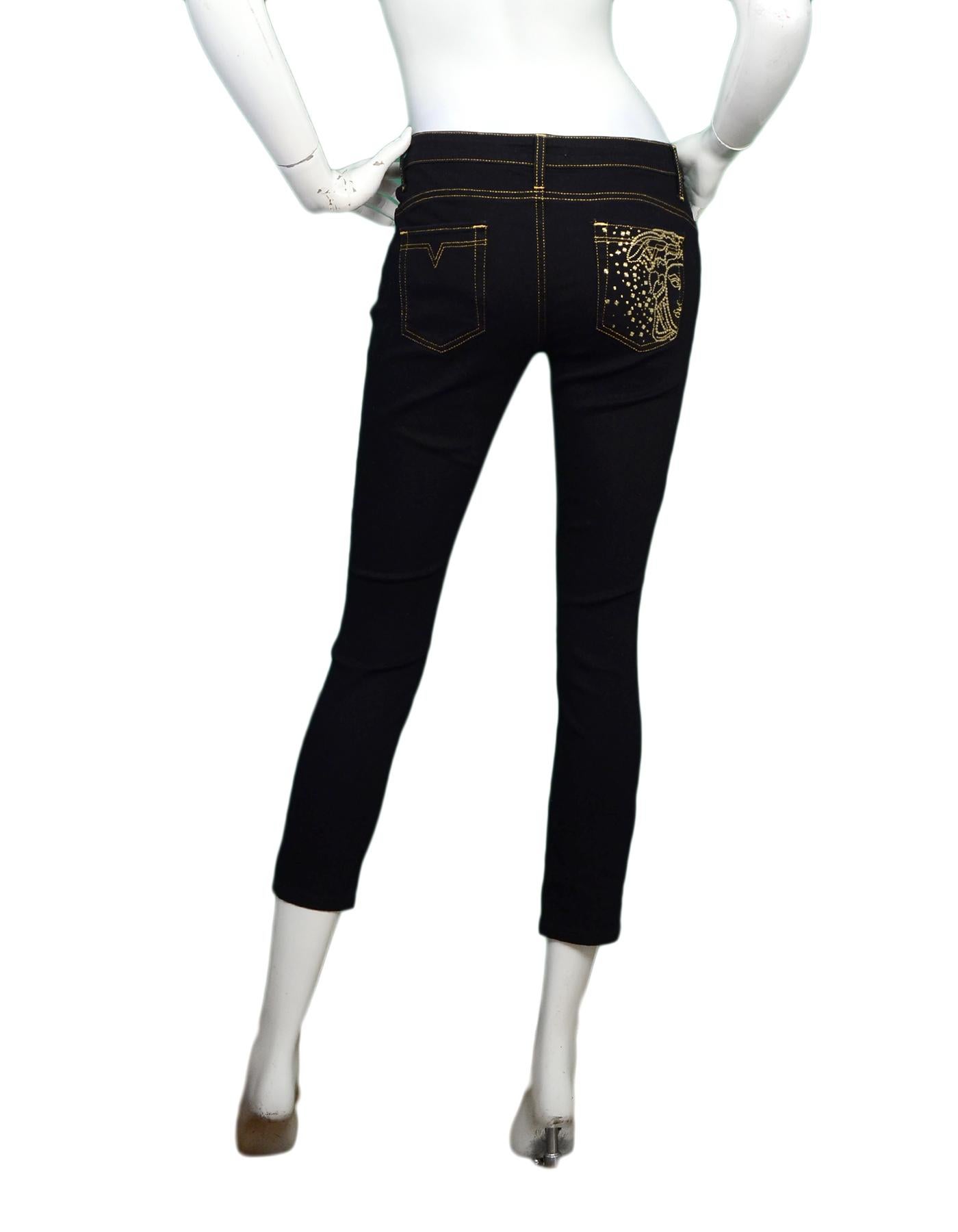black jeans with gold stitching