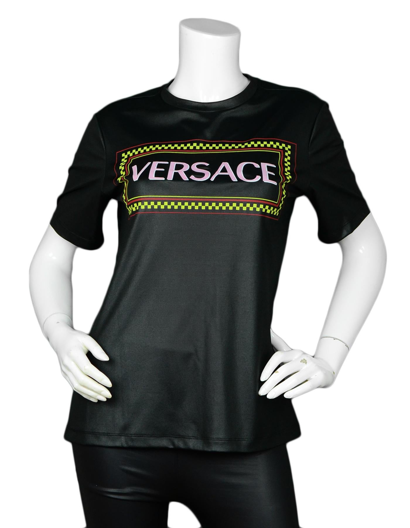 Versace Black Lacquered Jersey 90s Vintage Logo T-Shirt.  Versace's vintage 90s logo as been brought back for this classic style t-shirt.  Black laquered jersey creates a wet look.

Made In: Italy
Year of Production: 2018-2019
Color: Black with wet