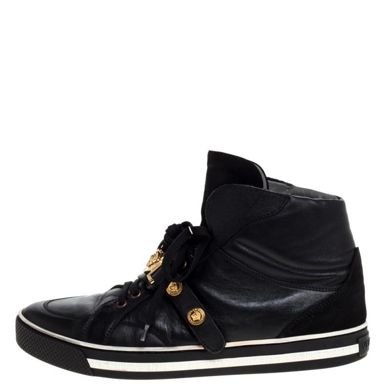 Brimming with fabulous details, these Versace sneakers are crafted from leather and suede into a high-top silhouette and feature lace-up vamps, gold-tone studs and the Medusa logo. Comfortable soles and a trendy appeal make these sneakers a