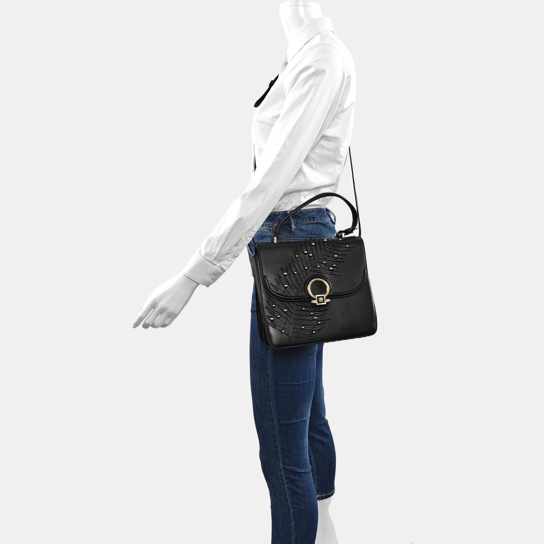 Versace Black Leather Applique Studded Flap Top Handle Crossbody Bag
These are professional photos of the actual bag offered by Luxbags.
CONDITION: MINT LIKE NEW
Light scratches to the hardware.
DETAILS

Versace

Exterior Material: Leather and