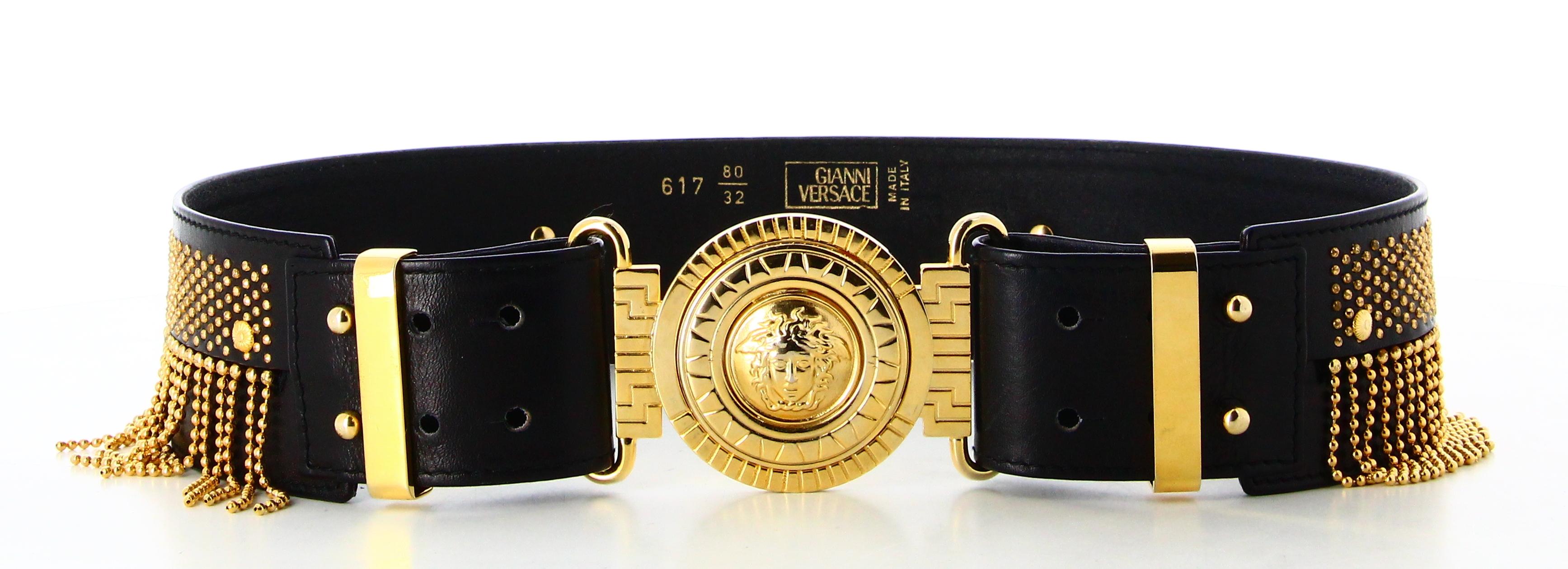 Versace Black Leather Golden Fringe Belt 

- Very good condition. Shows slight signs of wear over time. 
- Versace Black Leather Belt
- Black leather with golden fringe, Versace logo buckle
