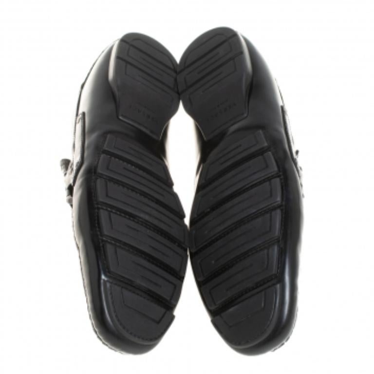 Precise stitching, use of quality leather, and a comfortable shape result in this pair of loafers. They are by Versace, and this is evidently displayed with the Medusa motif detailing on the uppers. The black loafers are finished with silver-tone