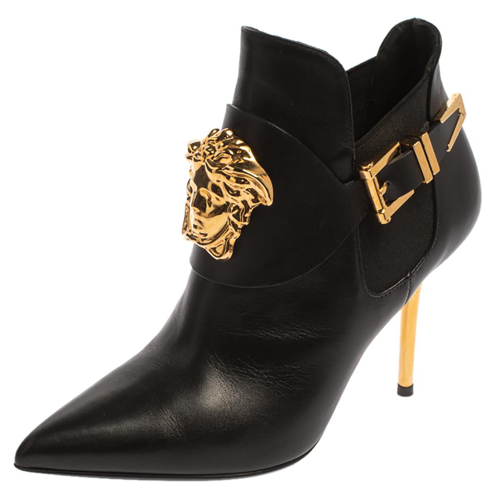 Brimming with fabulous details, these Versace booties are crafted from leather into a sleek silhouette and feature pointed toes and the signature Medusa logo detailing, and buckles on the sides. Comfortable insoles and a trendy appeal make these