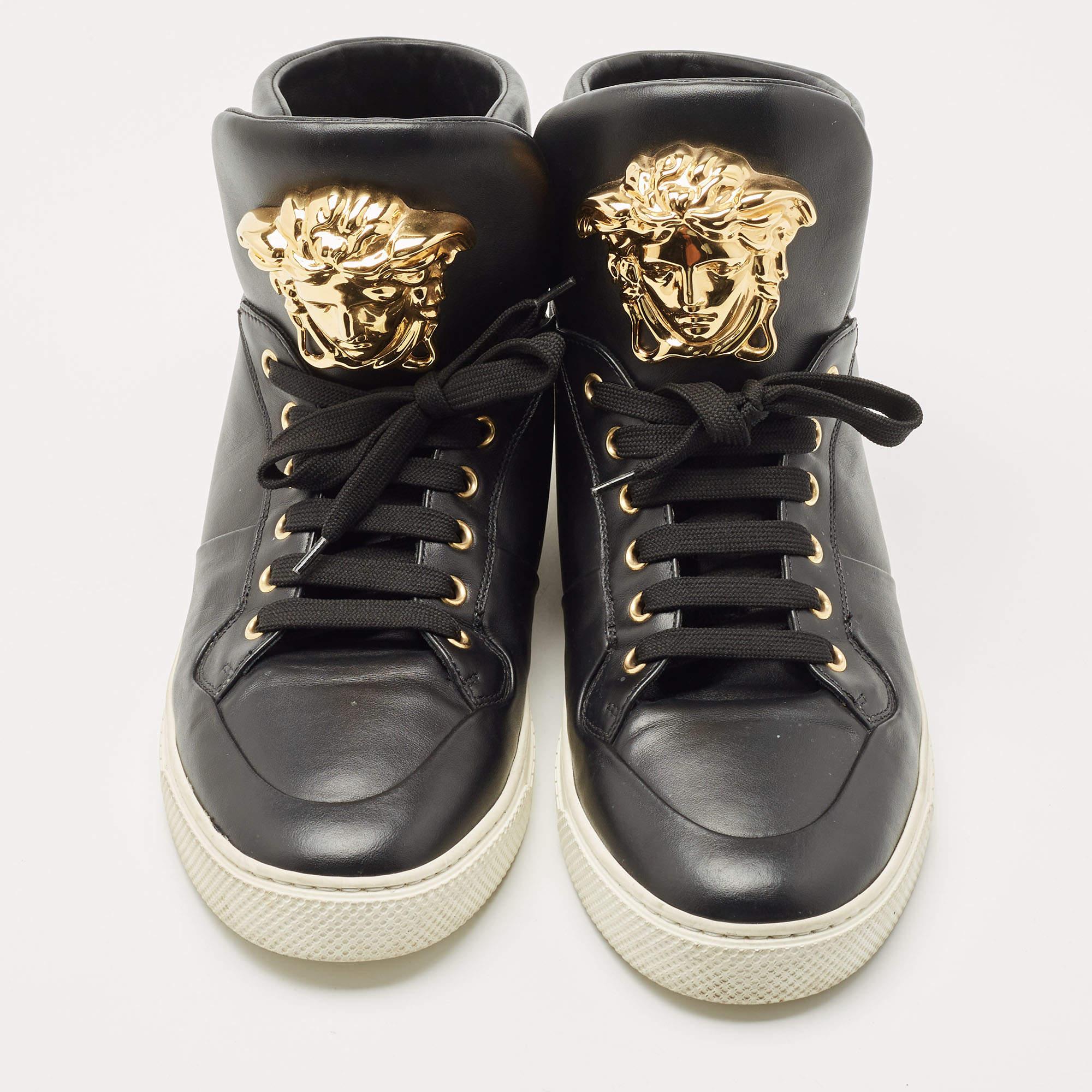 Sneakers are sought-after for reasons like comfort, ease and casual style. These Versace high tops fit right in as they are stylish and snug. Brimming with fabulous details, these Versace sneakers are crafted from leather into a high-top silhouette