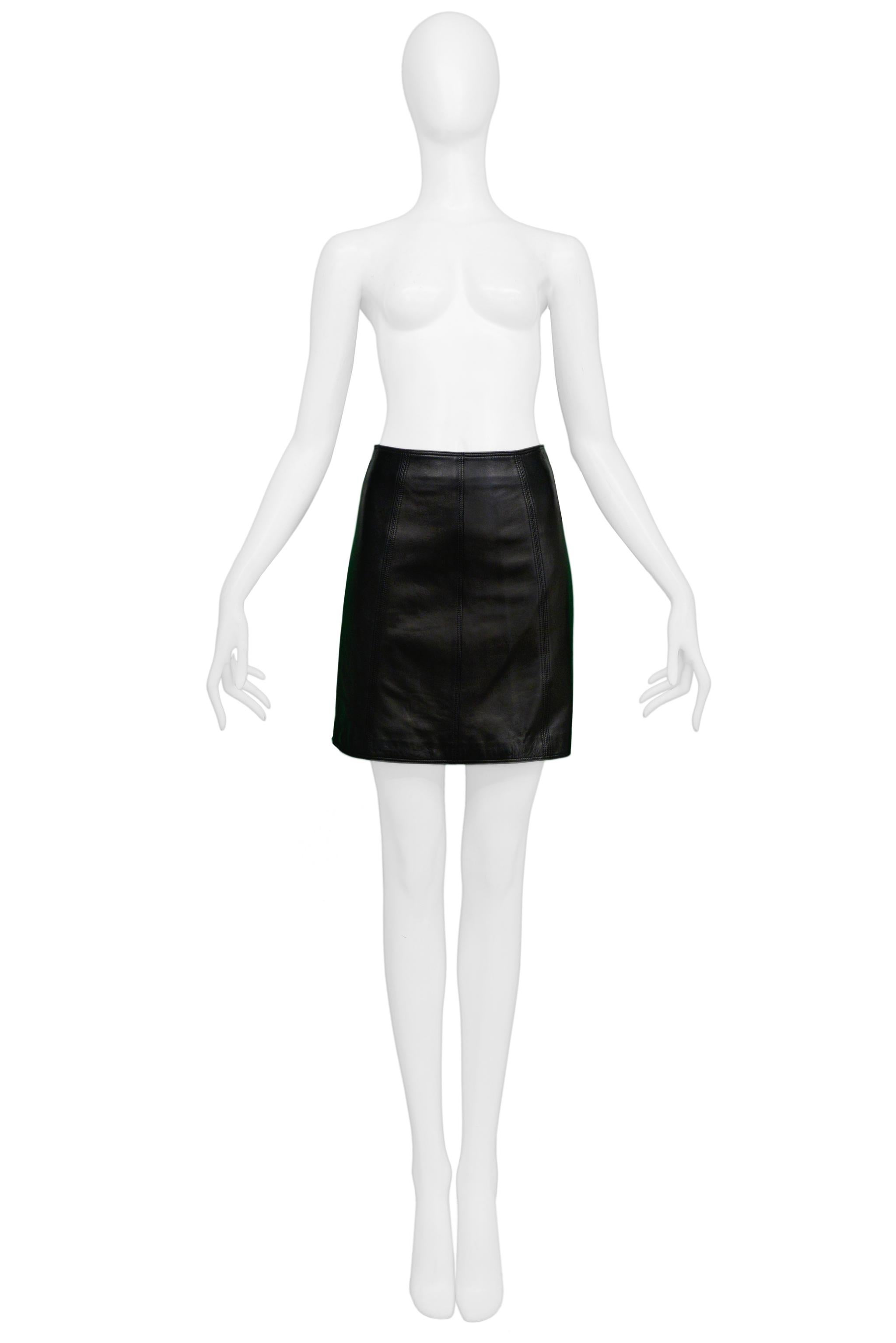 Resurrection Vintage is excited to offer a vintage Versace black leather mini skirt featuring a slightly high waist, decorative black stitching, and a center back zipper. 

Versace
Size Small
Waist: 24/25