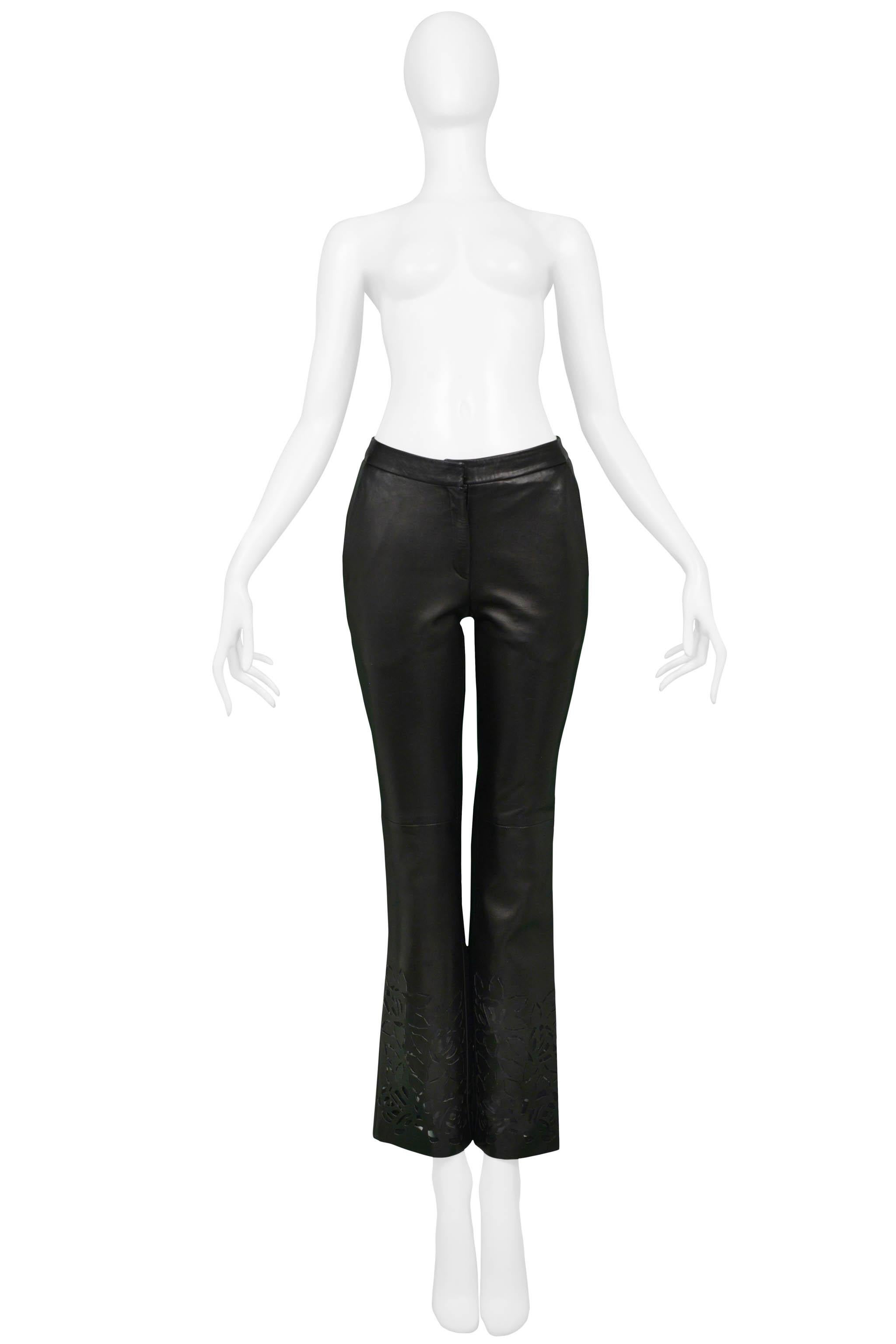 Resurrection Vintage is excited to offer a pair of vintage Versace black leather pants featuring a slim fit, side pockets, and floral laser-cutouts on the front and back of legs. 

Versace
Size: Small
Fabric: Leather
Excellent Vintage