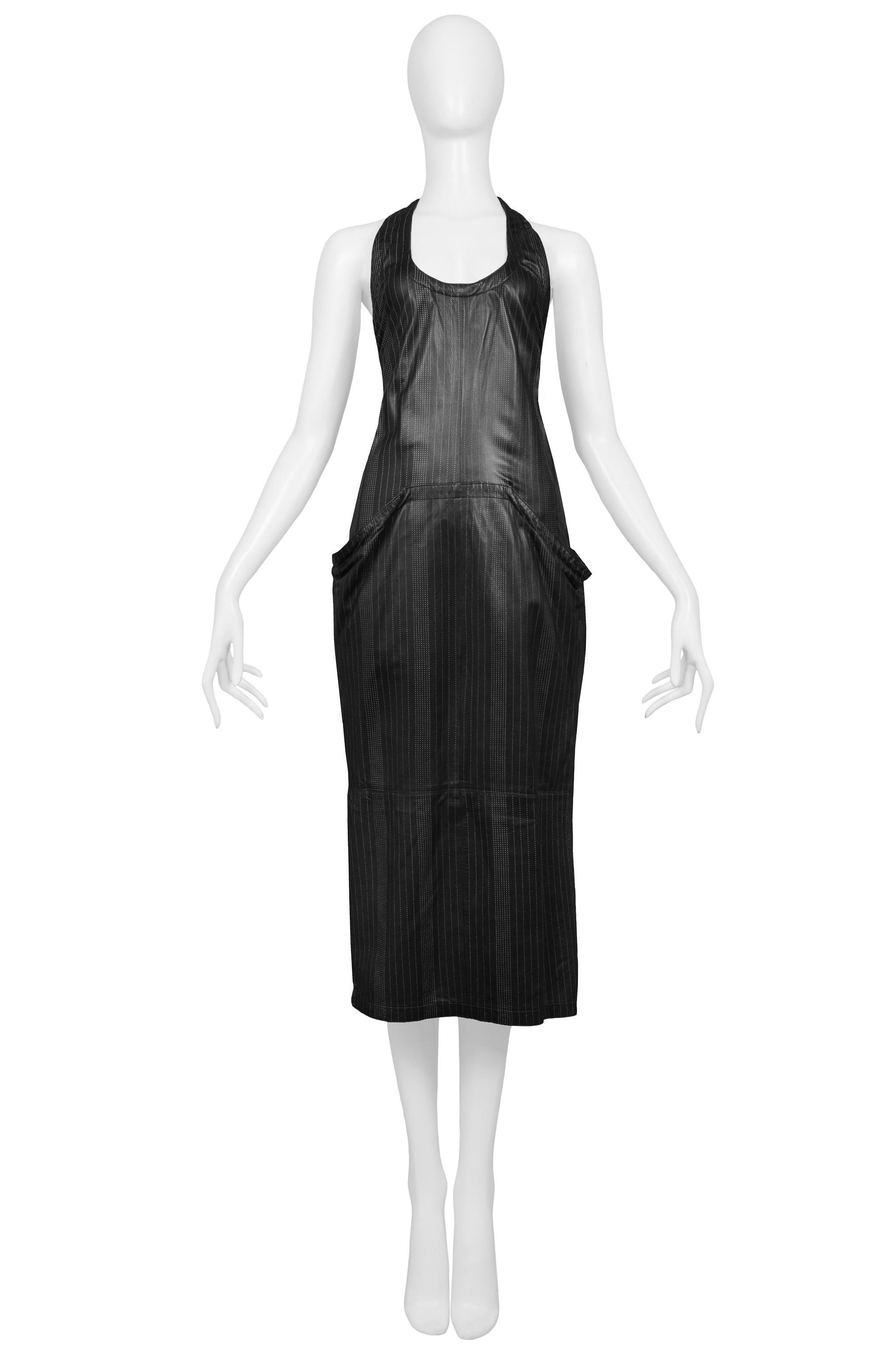 Resurrection Vintage is excited to offer Gianni Versace black leather day dress featuring an dotted pinstriping,tank body, front kangaroo pocket, and fitted sexy silhouette. 

Versace 
Size Label Missing - Today's size Small or 2-4
Measurements: