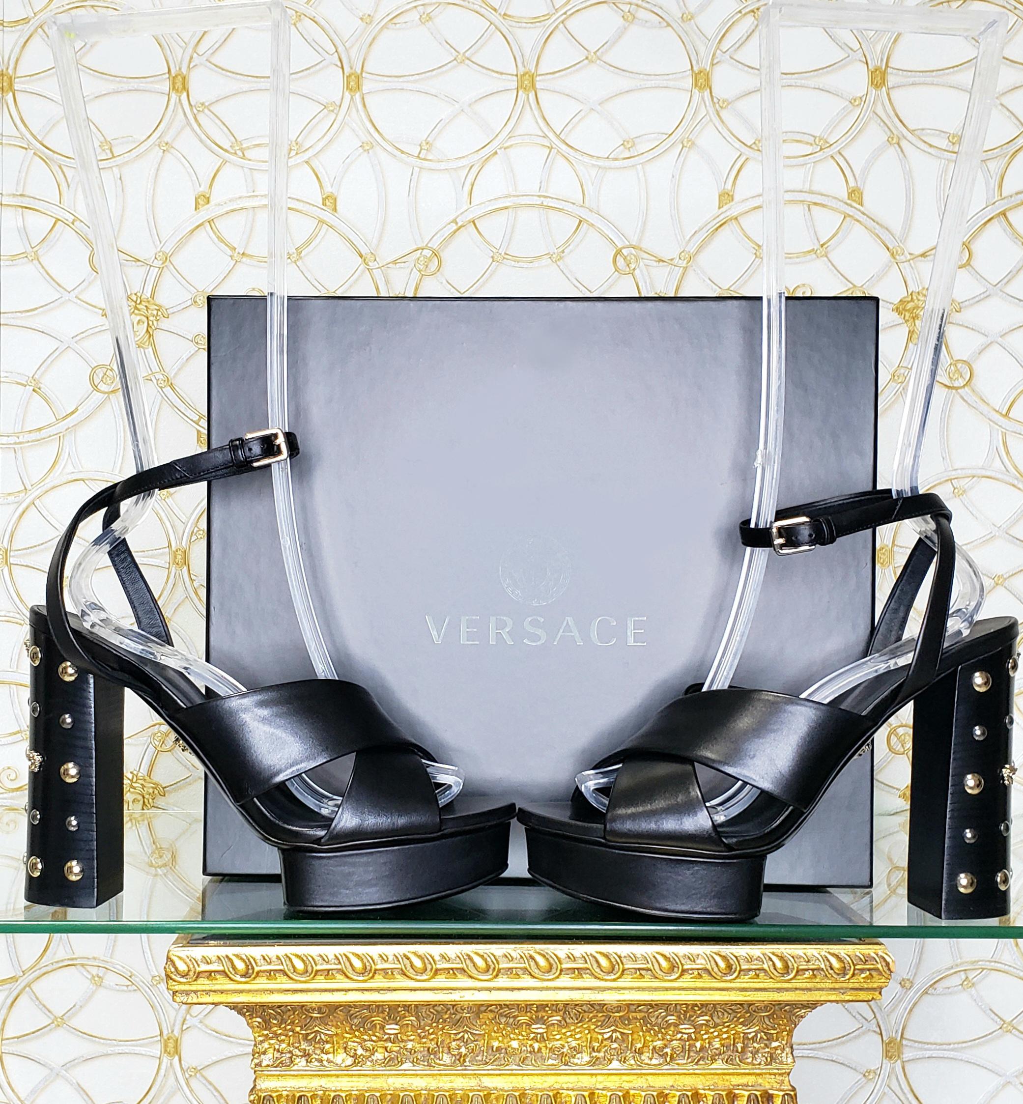 VERSACE

Black leather sandals shoes with gold and silver studs and famous Medusa Studs

DETAILS:

Open toe and heel

Buckling ankle strap closure

Content: 100% Leather (Lining and Sole) 


   Color: Black

Heel: at around 5