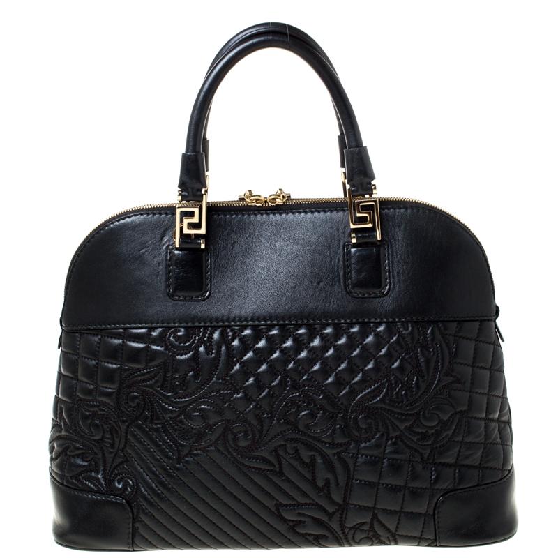This black satchel from Versace will give you days of style and ease. It is crafted from leather and features a dangling gold-tone charm. It is equipped with a spacious fabric interior, two handles and metal feet.

This black satchel from Versace