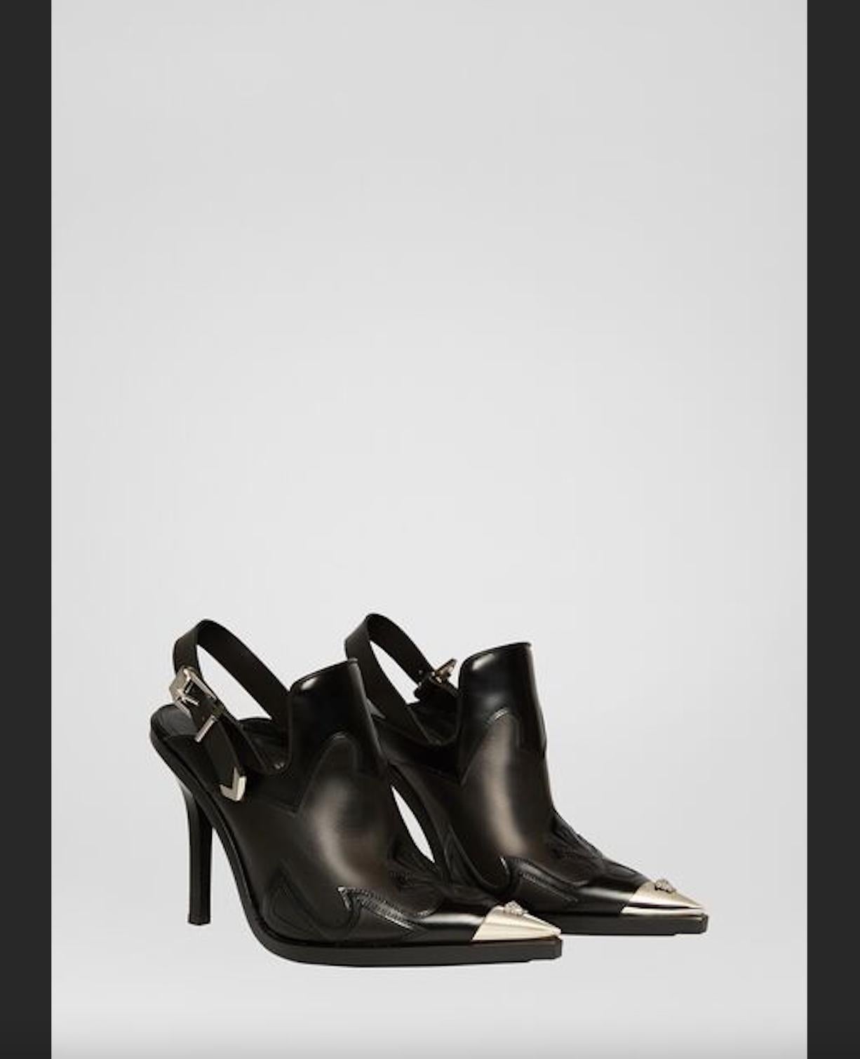 Versace Black Leather V-western Slingback Boot / Pump

These Versace heels embrace a chic western vibe. Called the V-Western sling back pumps, it is enriched with western-style stitching and palladium-tone toe accent embellished with a Medusa head.