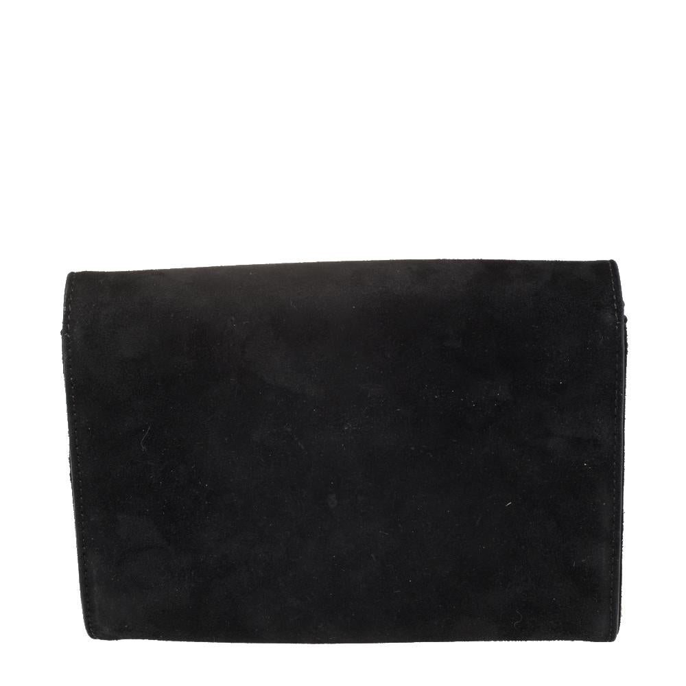 This clutch from Versace is designed in black suede. It brings a Medusa-adorned flap to secure the interior which is lined with satin and leather. It comes held by a gold-tone chain and is perfect for evenings.

