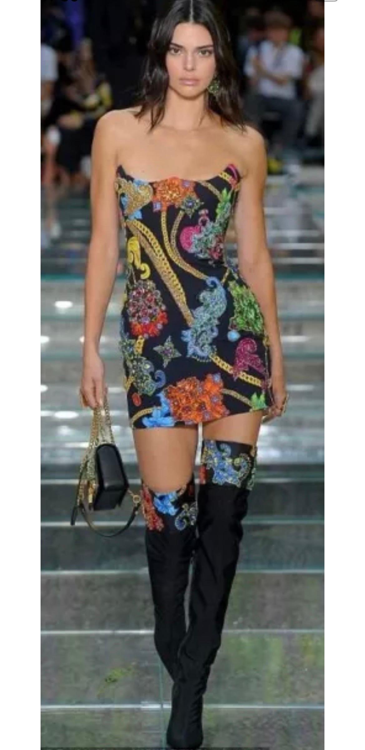 VERSACE BOOTS
Material: Fabric, Lining material: Leather
Color: Black
Pattern: Solid; with chain Print
Closure: Zip
Extra Detail: Leather lined to give it structure. Crystal jewels embellishments on print. 
Fold over design at top. Zipper closure on