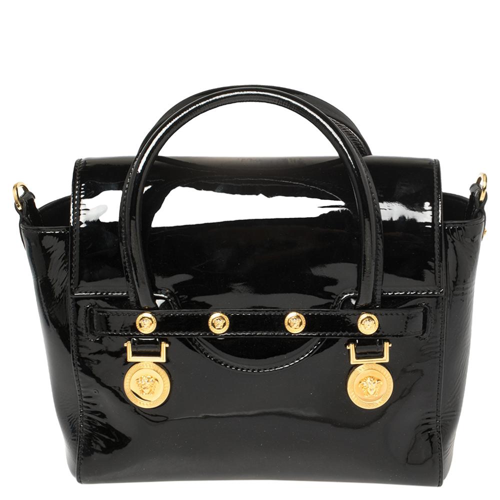 This Versace patent leather satchel has an alluring design. Beautifully crafted, the bag comes with a highly durable exterior detailed with the Medusa motif on the front, a spacious satin interior, two handles, and a shoulder strap. The creation is