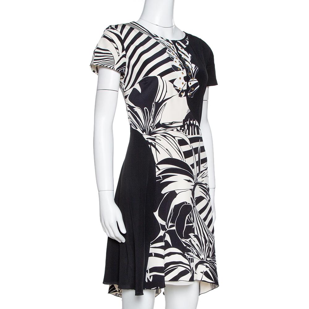 Feminine and refined, Versace's printed dress is a statement-making choice. It's cut from silk and designed with a fitted waist and short sleeves. The knee-length dress is ideal to be paired with both pumps and sandals.

Includes: Price Tag