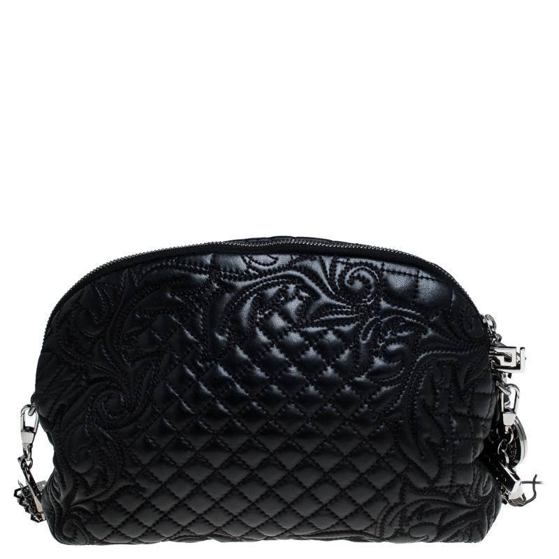How gorgeous is this shoulder bag from Versace! Crafted from black leather and black-tone hardware, it carries an outstanding design. It has a satin interior secured by zippers and it is held by a metal-detailed shoulder strap. The quilt detailing