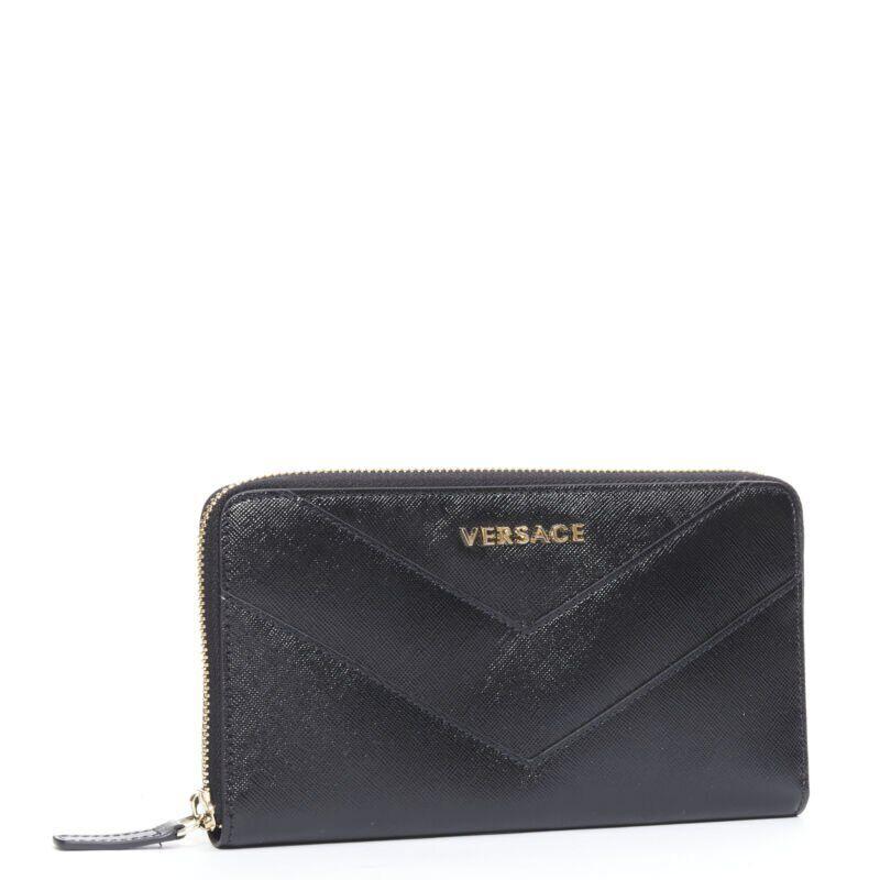 VERSACE black saffiano leather gold logo V stitch continental long wallet
Reference: TGAS/B01476
Brand: Versace
Designer: Donatella Versace
Material: Leather
Color: Black
Pattern: Solid
Closure: Zip
Lining:  Leather
Extra Details: Black saffiano