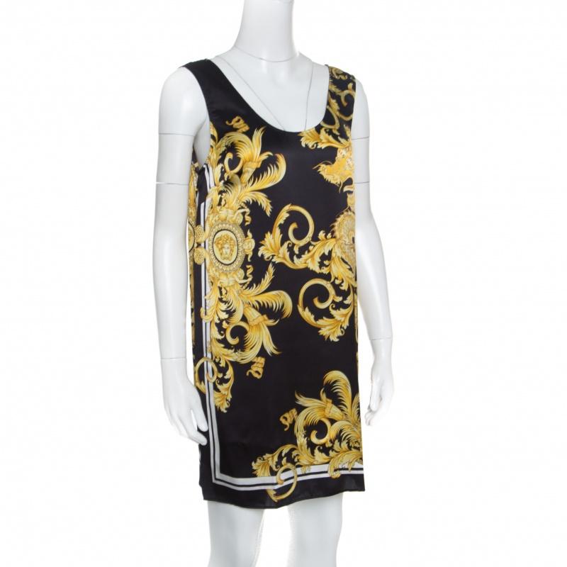 Feel high-fashion when you wear this mini dress from Versace. The dress flaunts a sleeveless style with a scoop neck and scarf prints all over. You'll look fabulous when you assemble this creation with strappy sandals and a cropped