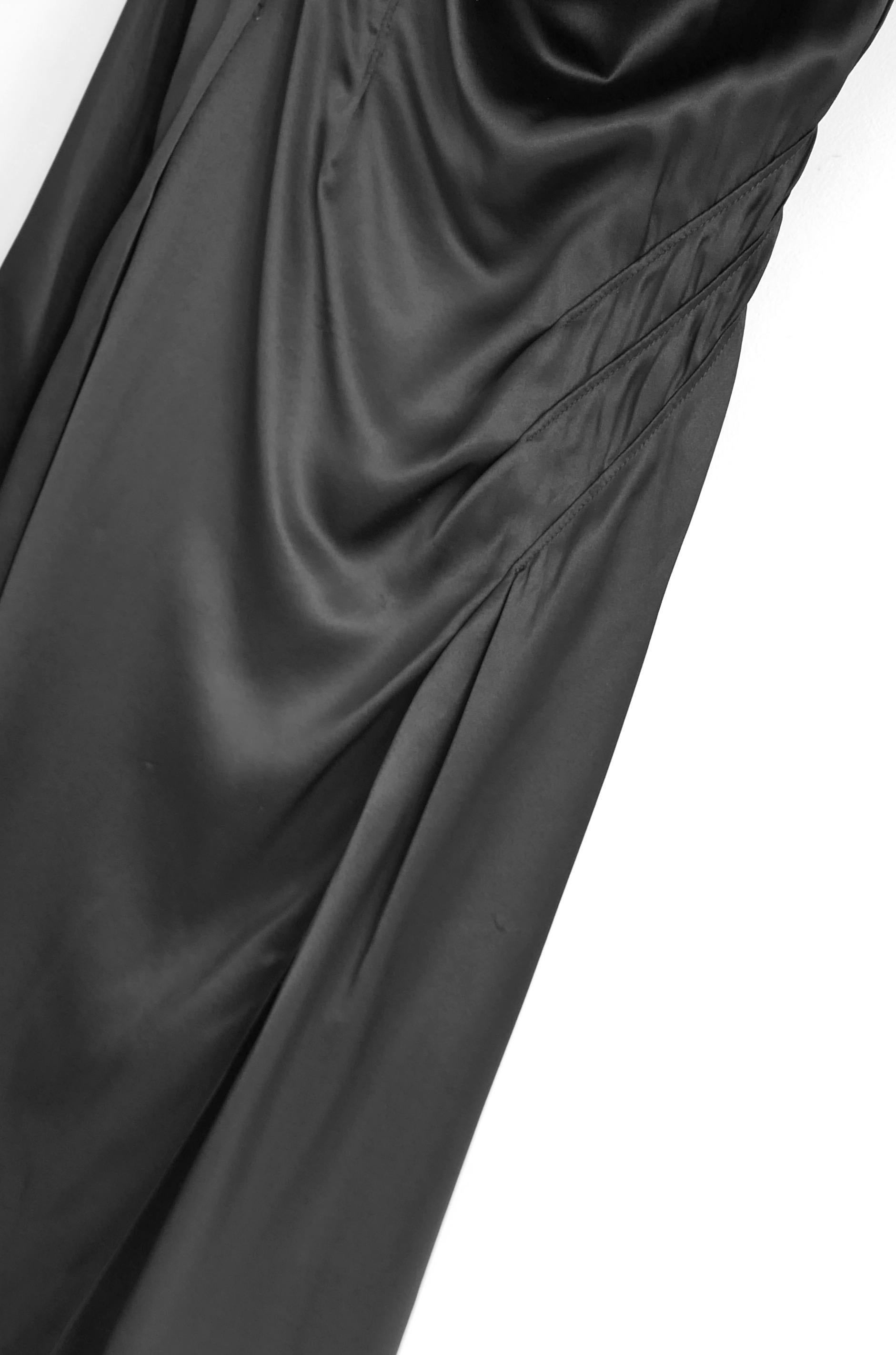 Stunningly slinky Versace black silk double slip dress. Bought for £1475 and unworn. Made from glossy black silk with silk chiffon inner slip, it has asymmetric draped neckline, darted detailing and fared hem.  Size IT40/UK8. Measures approx - bust